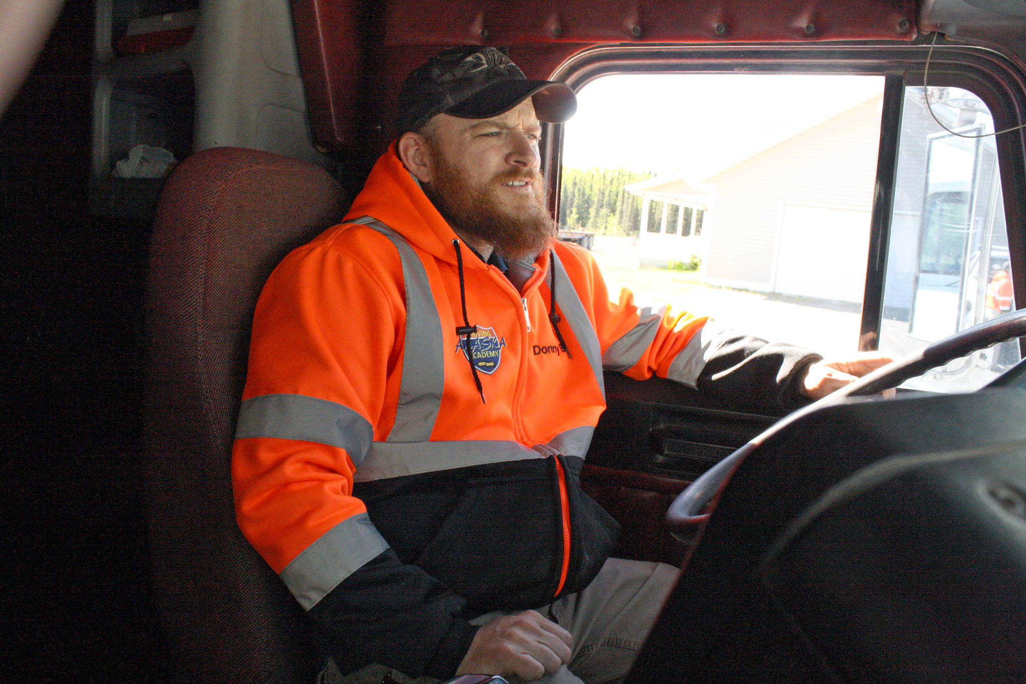 Behind-the-wheel trainer Donny Bergonzini sits in a truck at the Alaska Driving Academy in Sterling on Thursday. Bergonzini, who has 19 years experience in the oil industry, provides commercial driver’s license training at the recently opened academy. (Photo by Erin Thompson/Peninsula Clarion)