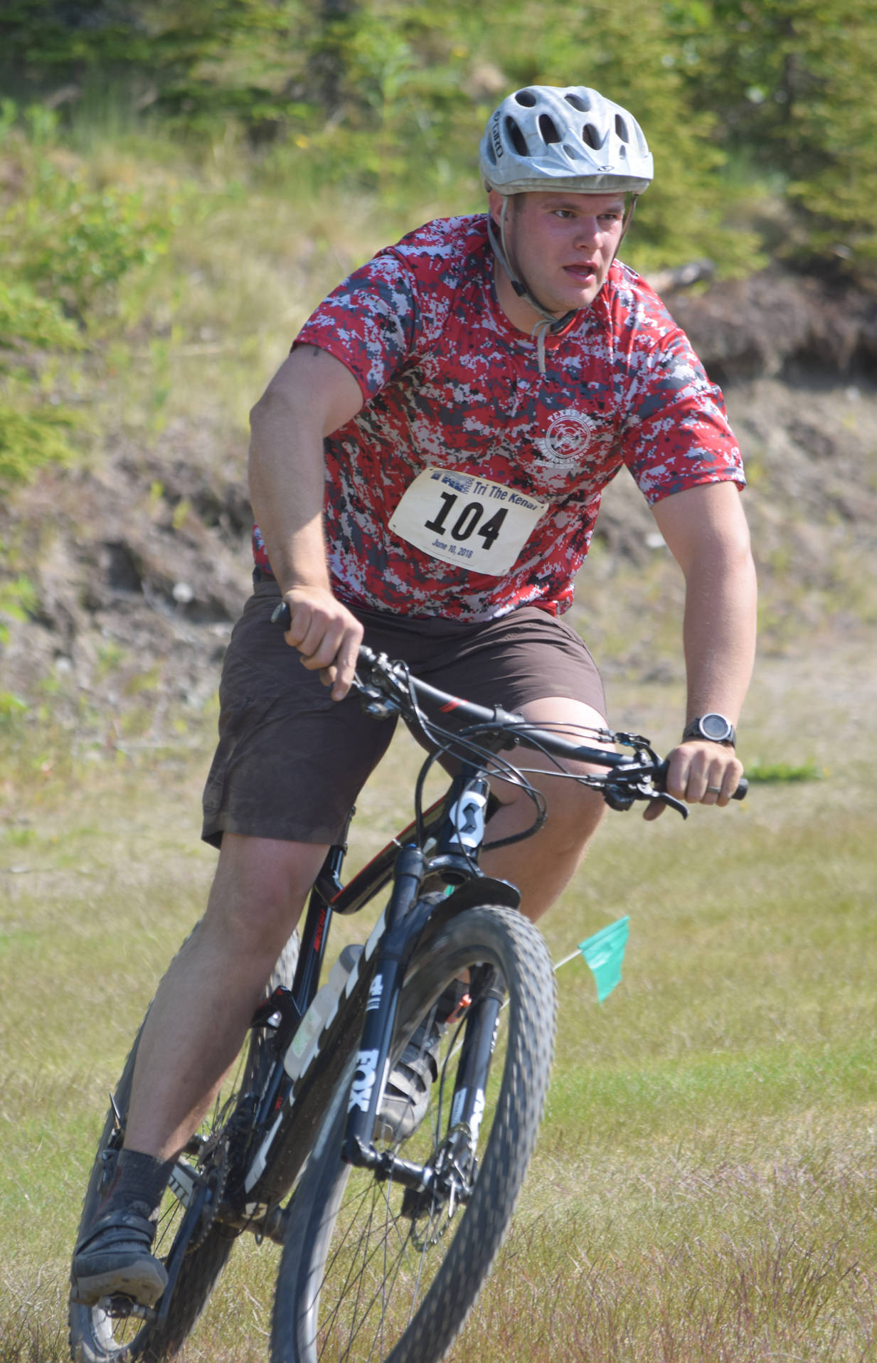 Andrew Kircher of Kenai rounds a corner at Tsalteshi Trails during the mountain bike portion of the duathlon Sunday, June 10, 2018, at Tri-The-Kenai. (Photo by Jeff Helminiak/Peninsula Clarion)