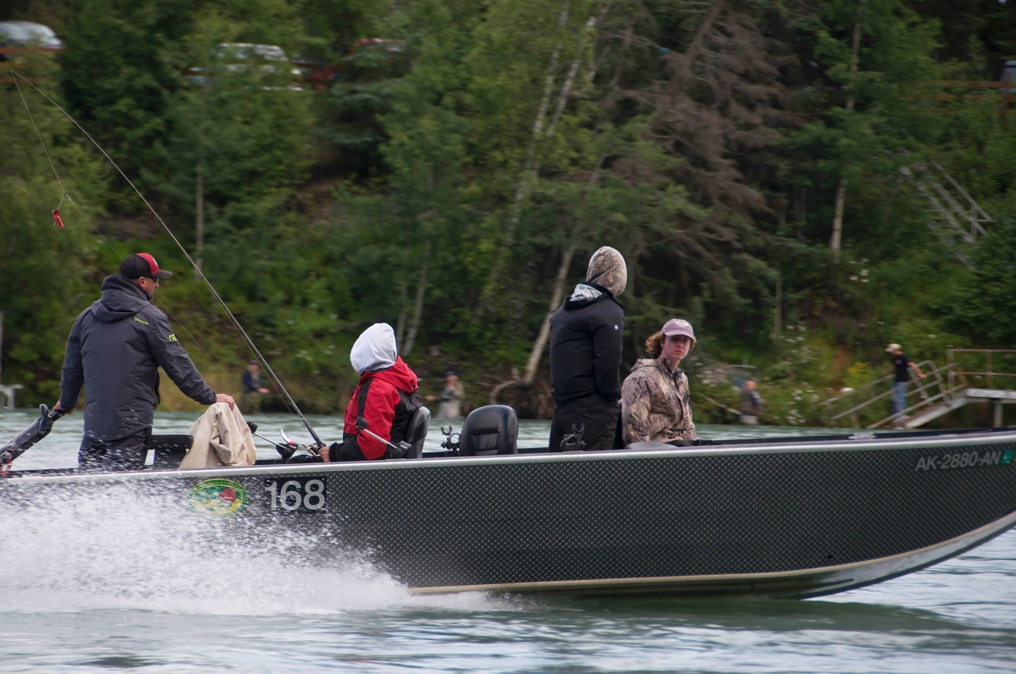 In this July 2016 photo, a fishing guide pilots a boat up the Kenai River near Soldotna. (Photo by Elizabeth Earl/Peninsula Clarion, file)