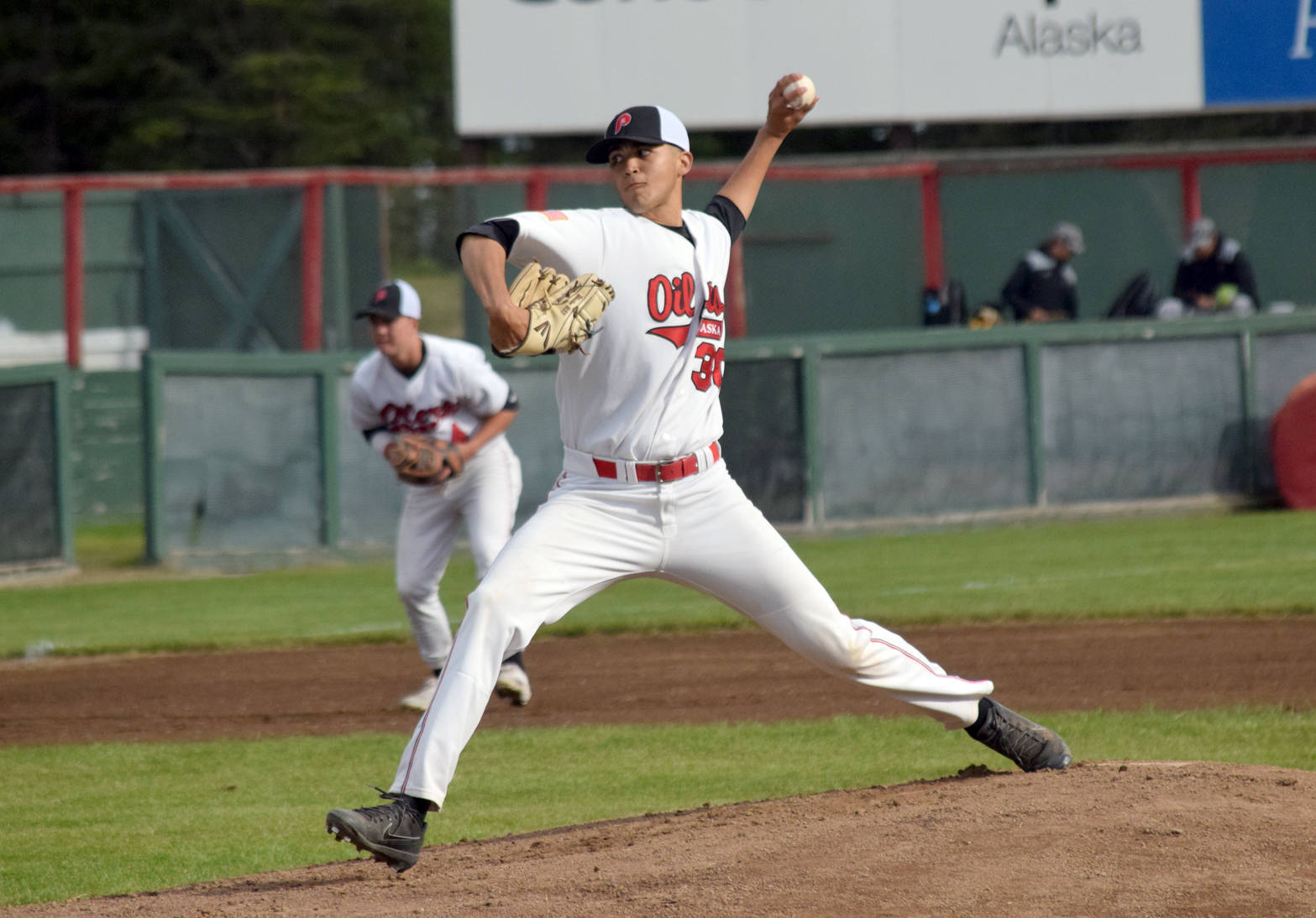 Oilers starter Christian Winston delivers home against the Anchorage Bucs on Monday, June 11, 2018, at Coral Seymour Memorial Park in Kenai. (Photo by Jeff Helminiak/Peninsula Clarion)