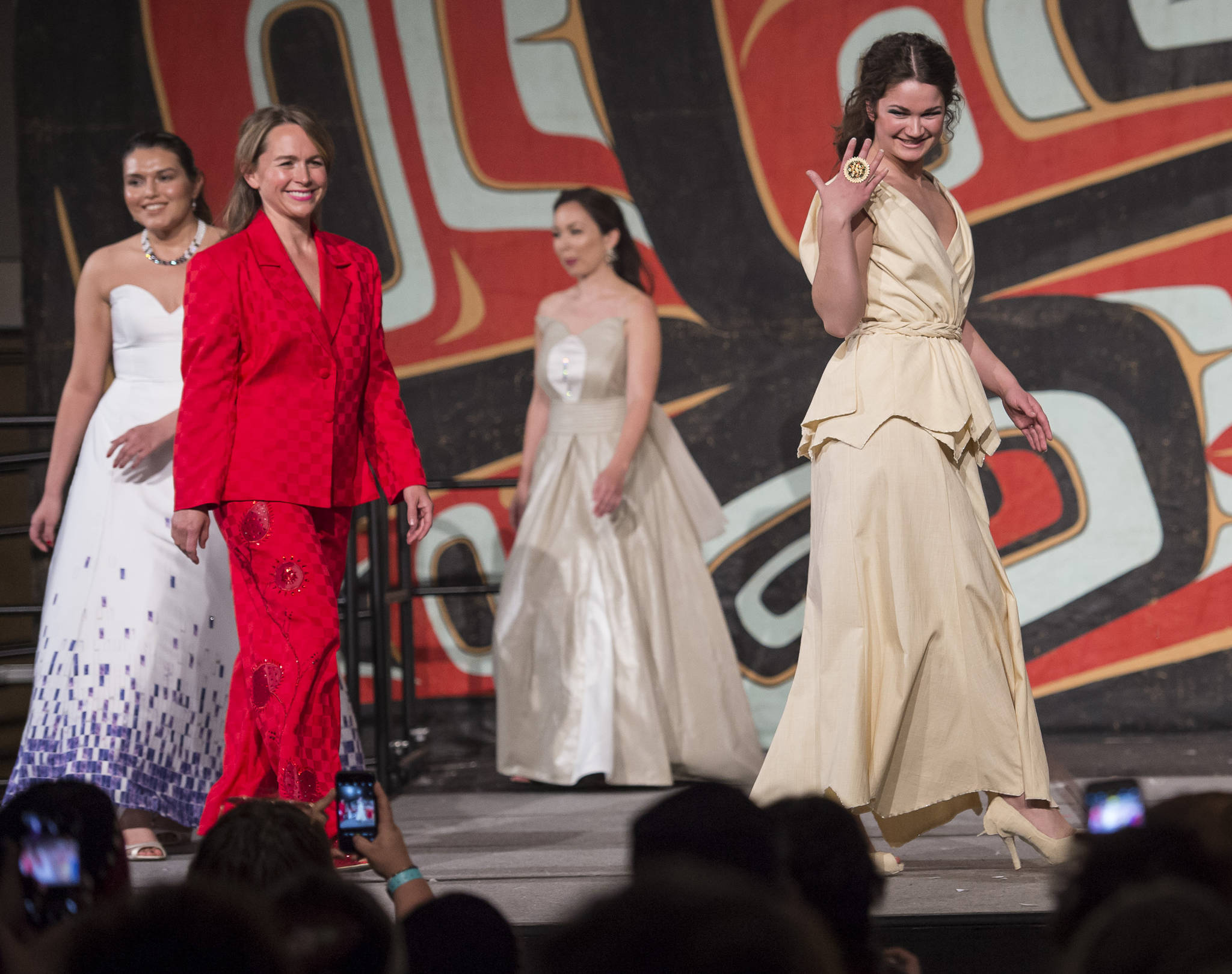 A models displays designers Jason Brown and Donna Decontie-Brown’s work at the Native Fashion Show at Centennial Hall on Friday, June 8, 2018. (Michael Penn | Juneau Empire)
