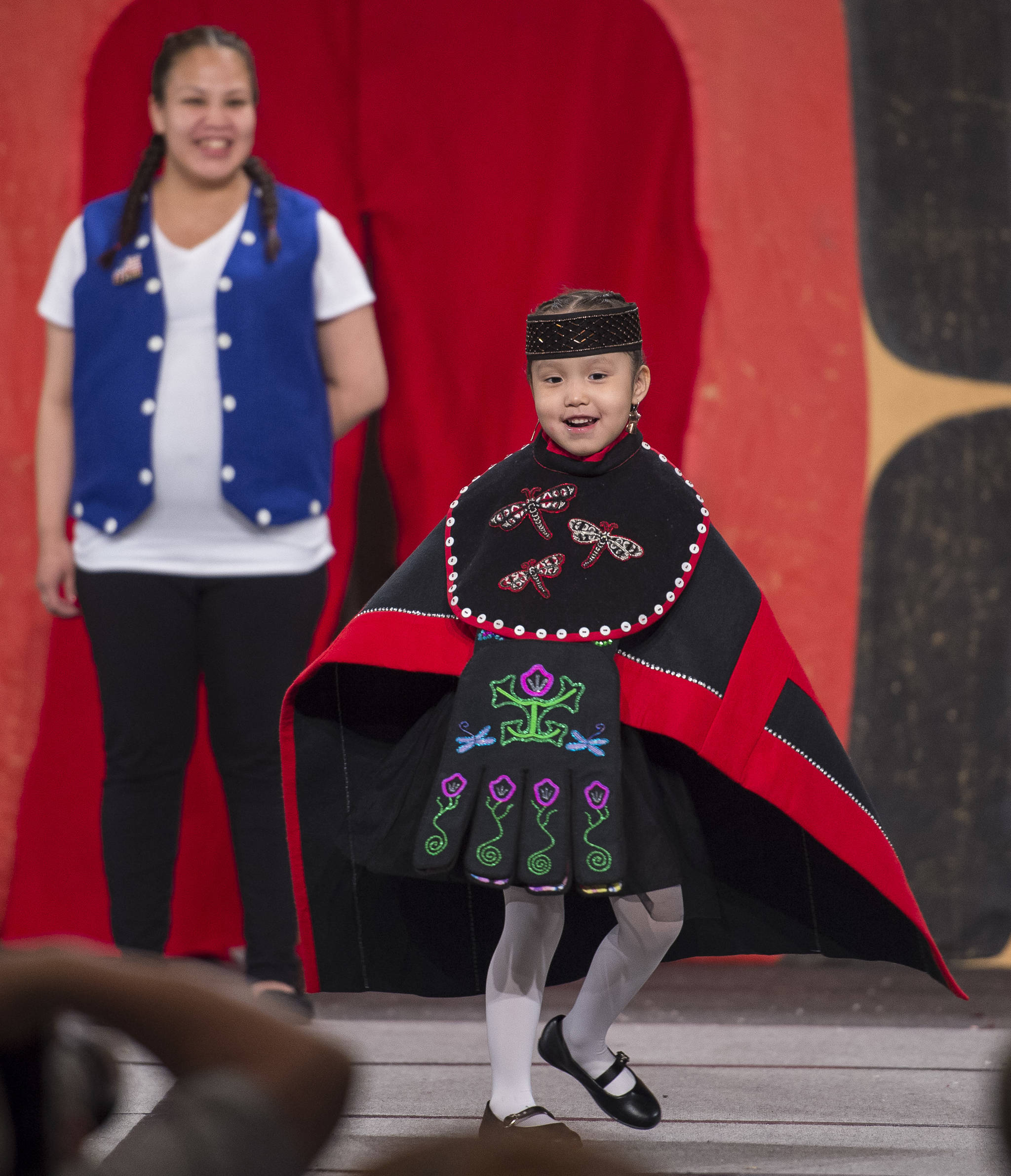 McKayla Paul participates with her mother in the Toddler Fashion Show on the main stage at Centennial Hall for Celebration 2018 on Friday, June 8, 2018. (Michael Penn | Juneau Empire)