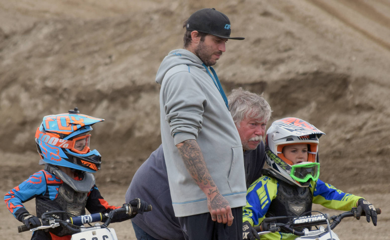 From left, Draiden Mullican; Draiden’s father, Shane; Draiden’s grandfather, John; and Draiden’s cousin, Kash Williams, get ready for the 50cc race at the Alaska State Motocross Championships on Sunday, June 17, 2018, at Twin City Raceway. (Photo by Jeff Helminiak/Peninsula Clarion)
