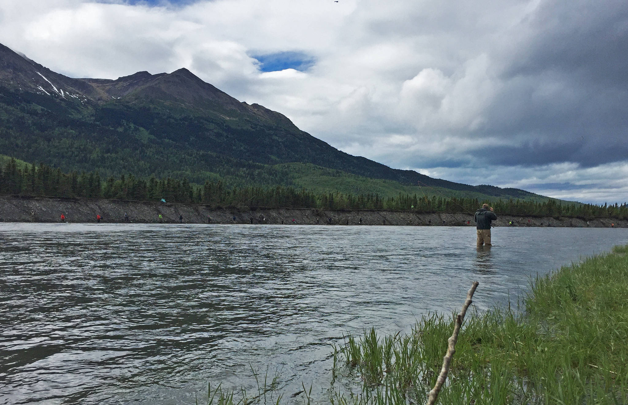 An angler prepares to cast a line into the Kenai River just downstream of the confluence with the Russian River on Monday near Cooper Landing. (Photo by Elizabeth Earl/Peninsula Clarion)