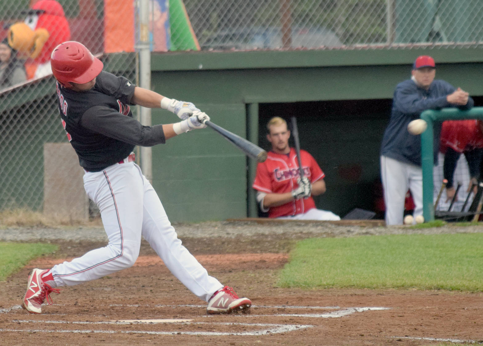 Oilers’ Grant Woods hits a double against the Chugiak-Eagle River Chinooks in the second inning Thursday, June 21, 2018, at Coral Seymour Memorial Park in Kenai. (Photo by Jeff Helminiak/Peninsula Clarion)