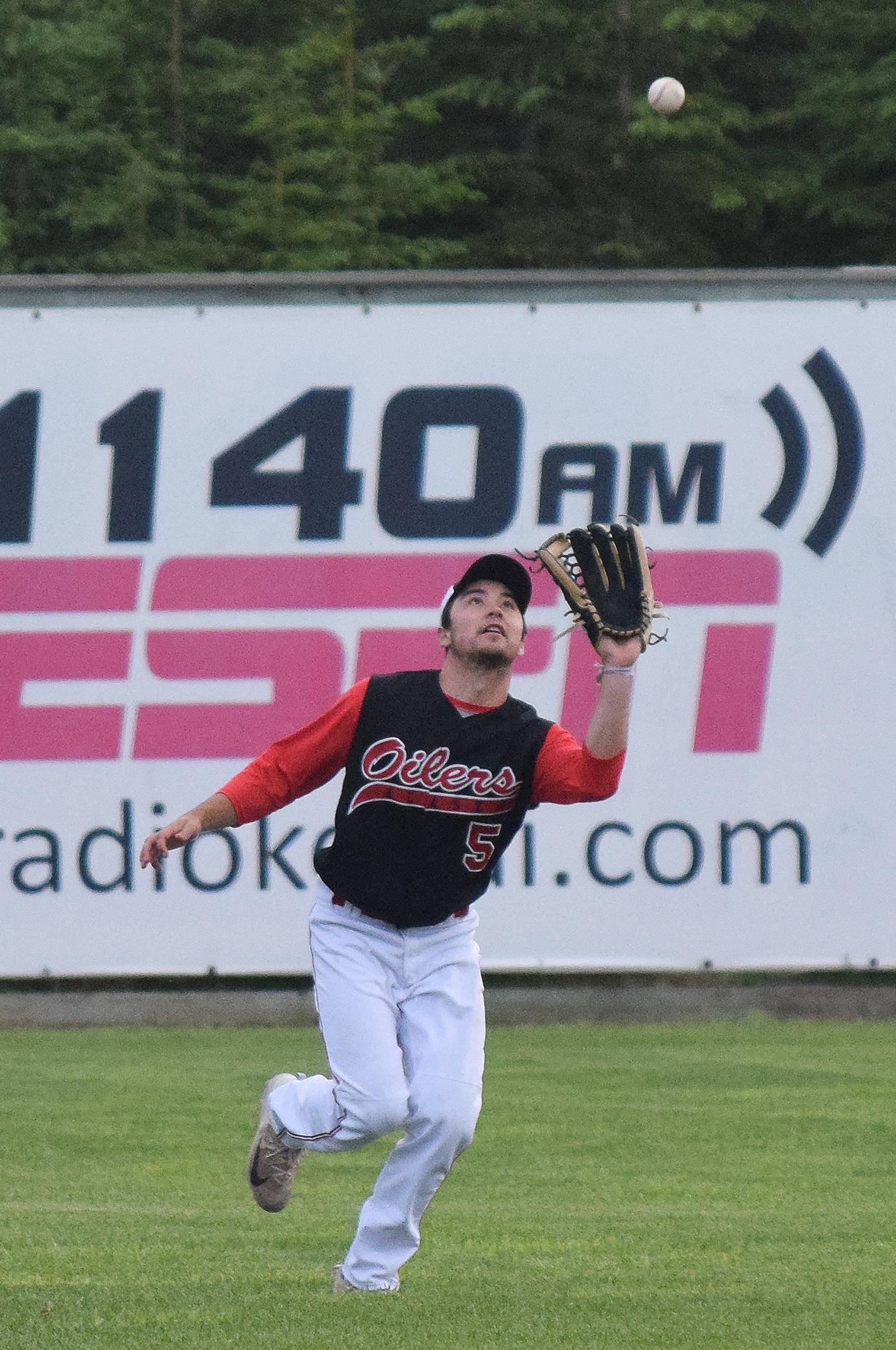 Peninsula Oilers outfielder Paul Kunst makes a catch Friday night against the Chugiak/Eagle River Chinooks at Coral Seymour Memorial Park in Kenai. (Photo by Joey Klecka/Peninsula Clarion)