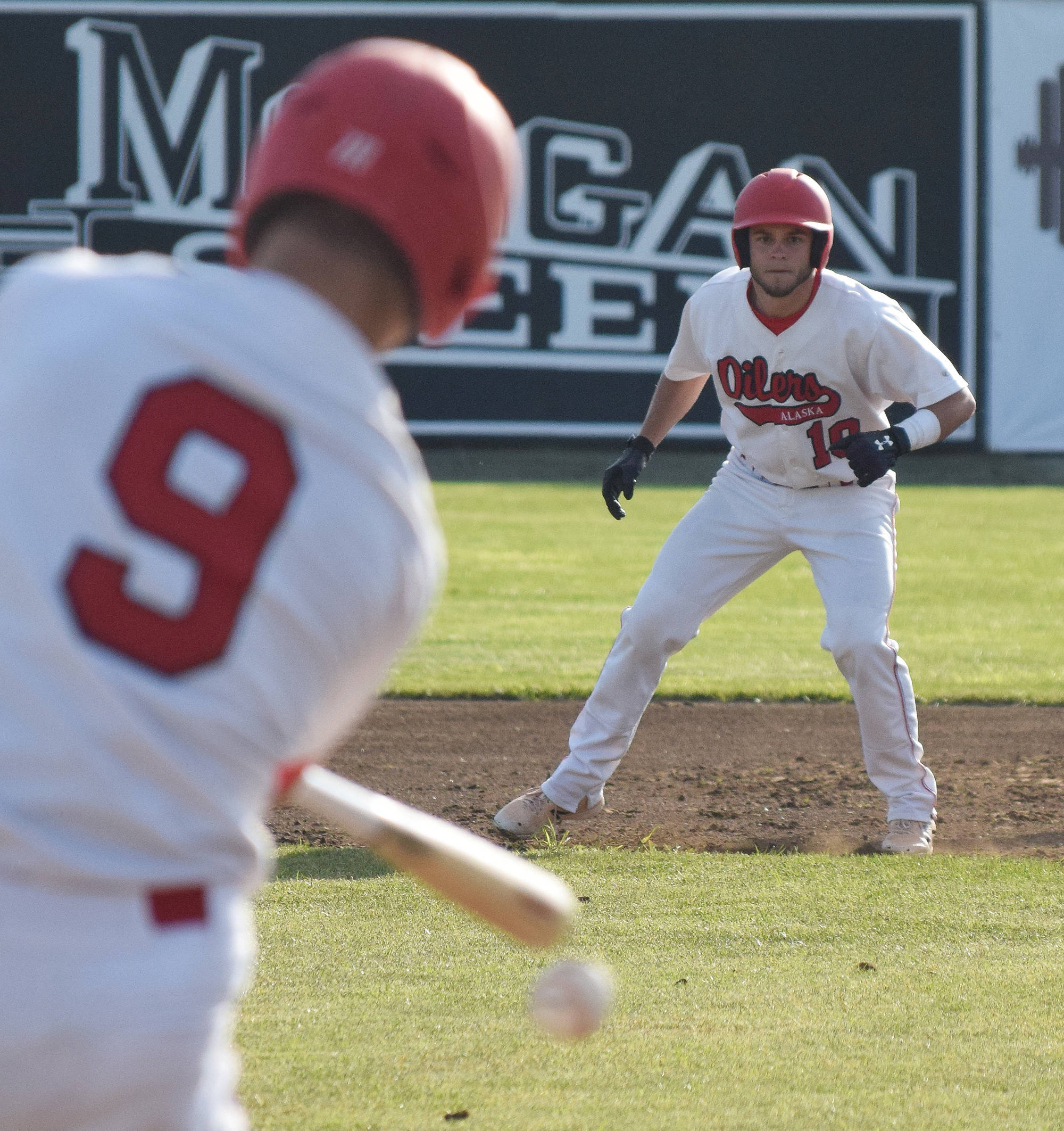 Peninsula Oilers infielder Jake Darrow keeps an eye on teammate Tyler Duke in a June 8, 2018, Alaska Baseball League game against the Anchorage Bucs at Coral Seymour Memorial Ballpark in Kenai. (Photo by Joey Klecka/Peninsula Clarion)