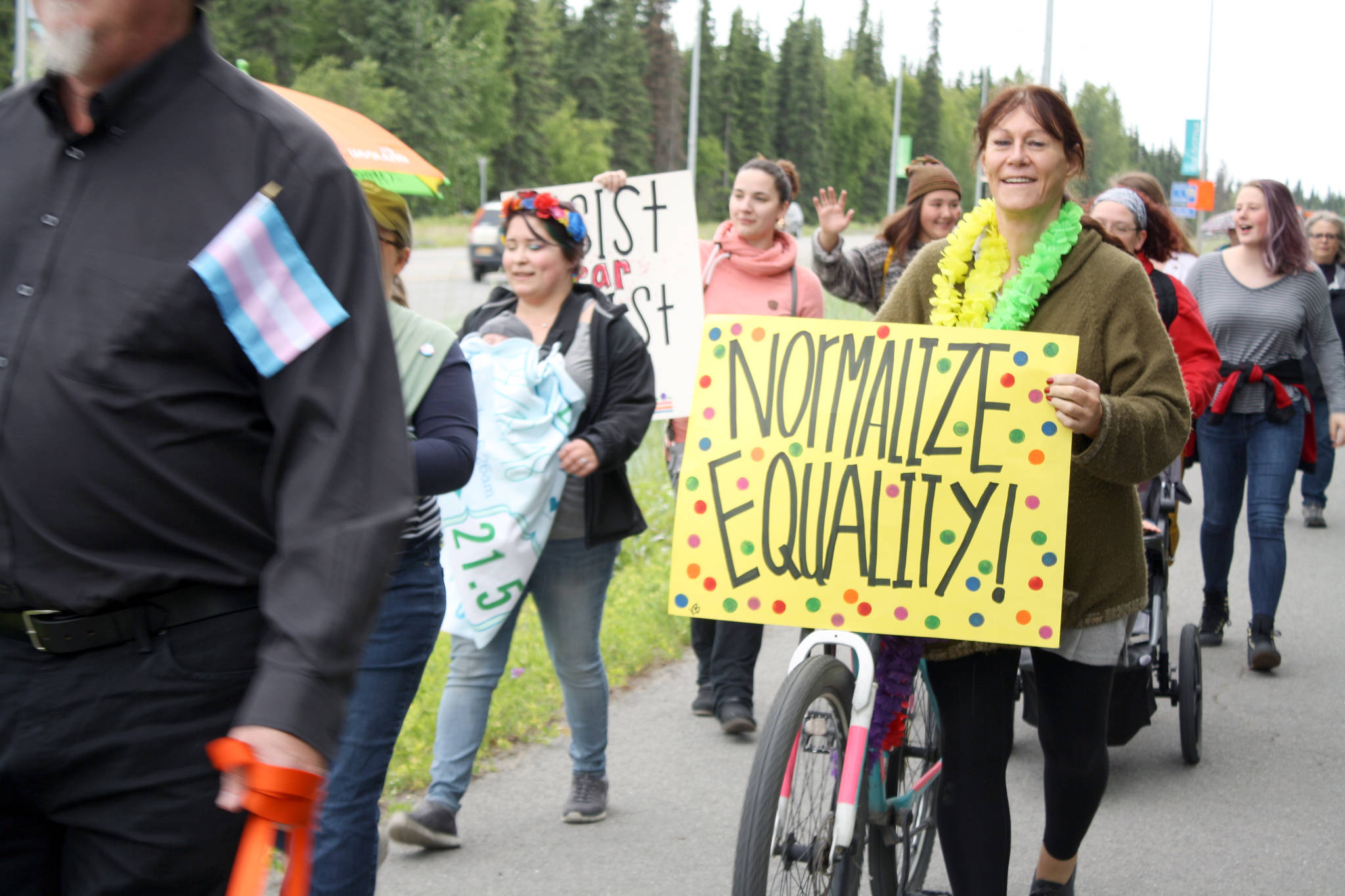 Participants in the Two Spirit Pride March walk along the Kalifornsky Beach Road on their way to Soldotna Creek Park Wednesday. About 60 people turned out to celebrate LGBTQ Pride. (Photo by Erin Thompson/Peninsula Clarion)