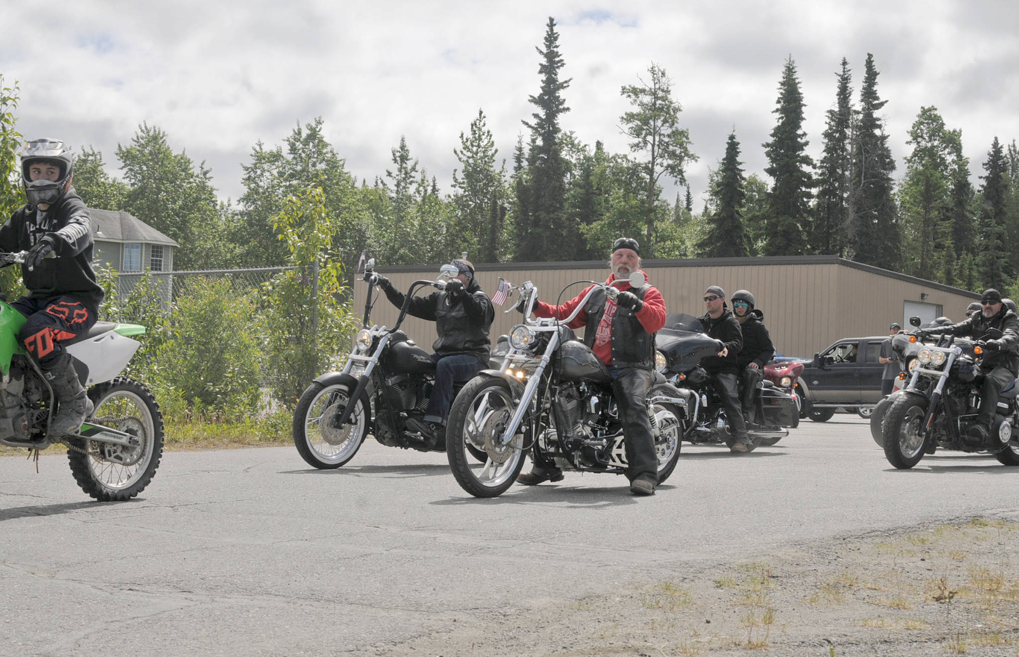 Motorcyclists line up as part of a procession to Travis Stubblefield’s memorial service at the driveway of the Harley-Davidson Motorcycles store on Saturday, June 30, 2018 in Soldotna, Alaska. Stubblefield, a lifelong resident of the Soldotna area, was killed June 21 in a conflict in Kasilof. Alaska State Troopers are investigating the circumstances of his death, though no charges have yet been filed. (Photo by Elizabeth Earl/Peninsula Clarion)