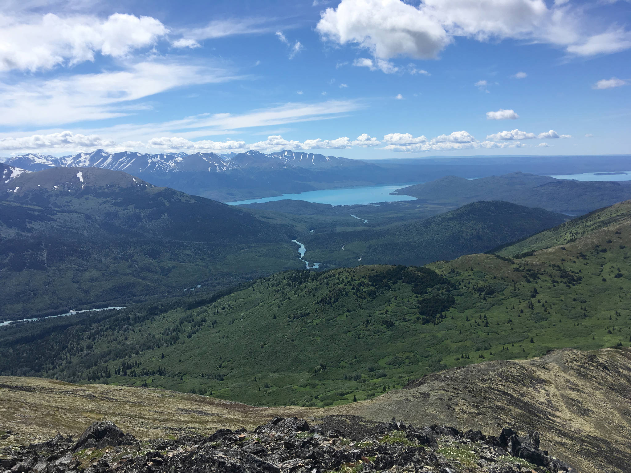 The Kenai River flows into Skilak Lake, as seen on a traverse from Fuller Lakes Trail to Skyline Trail on Sunday, July 1, 2018. The National Weather Service forecast says sunny skies should persist through Friday, with highs in the 60s and 70s. (Photo by Jeff Helminiak/Peninsula Clarion)