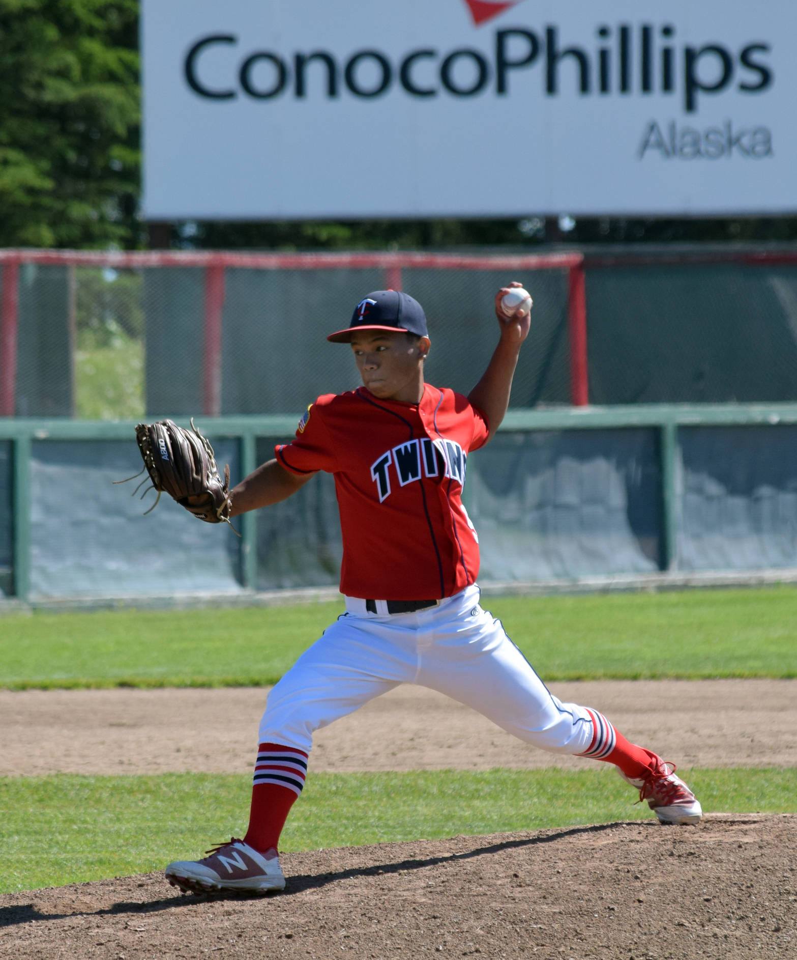 Post 20 Twins starter Harold Ochea delivers to Excelsior Post 259 from Minneapolis on Tuesday, July 3, 2018, at Coral Seymour Memorial Park in Kenai. (Photo by Jeff Helminiak/Peninsula Clarion)