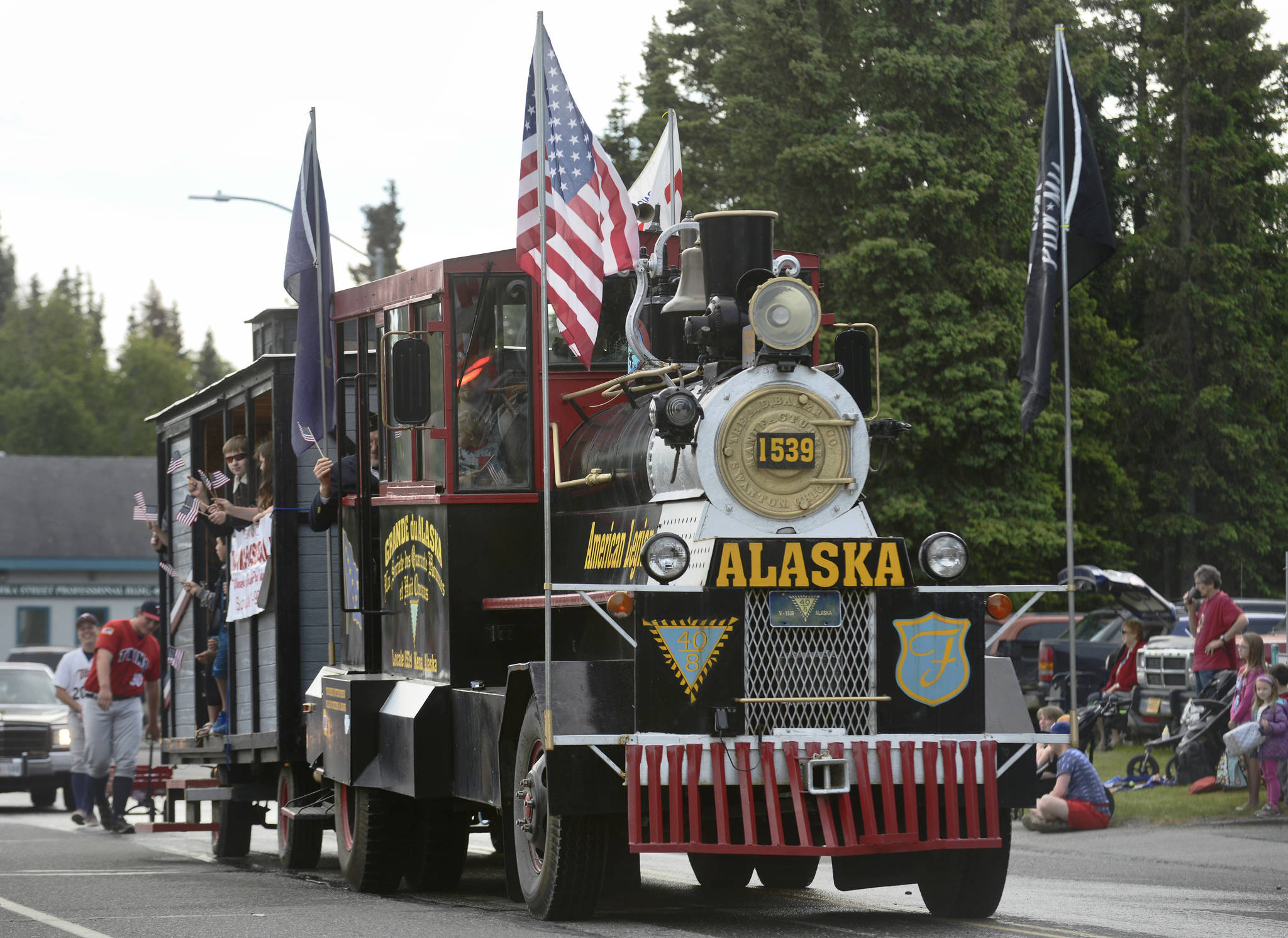 Kenai’s American Legion Post 20 drives their truck remodeled as a steam locomotive during Kenai’s Fourth of July parade on Wednesday, July 4, 2018 in Kenai, Alaska. Aboard are members of the Legion-sponsored Twins baseball team. (Ben Boettger/Peninsula Clarion)   Snare drummers from Kenai Central High School’s drumline perform in the Kenai’s Fourth of July parade on Wednesday, July 4, 2018 in Kenai, Alaska. (Ben Boettger/Peninsula Clarion)  Wildland firefighters from the Alaska Division of Forestry march in Kenai’s Fourth of July parade on Wednesday, July 4 in Kenai, Alaska. (Ben Boettger/Peninsula Clarion)