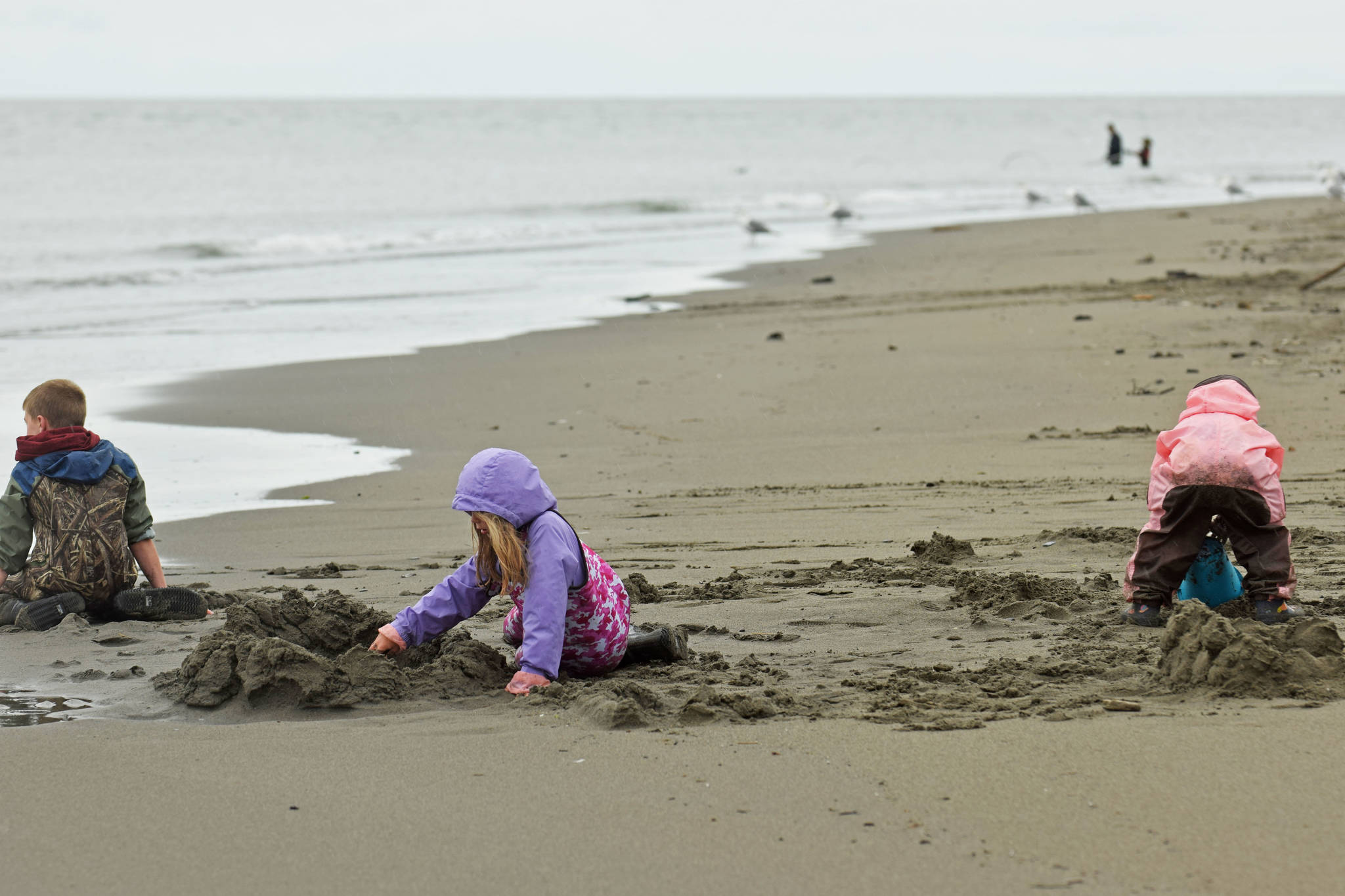 Youth play on the beach on Tuesday, July 10, 2018, during the first day of dipnetting season in Kenai, Alaska. (Photo by Erin Thompson/Peninsula Clarion)
