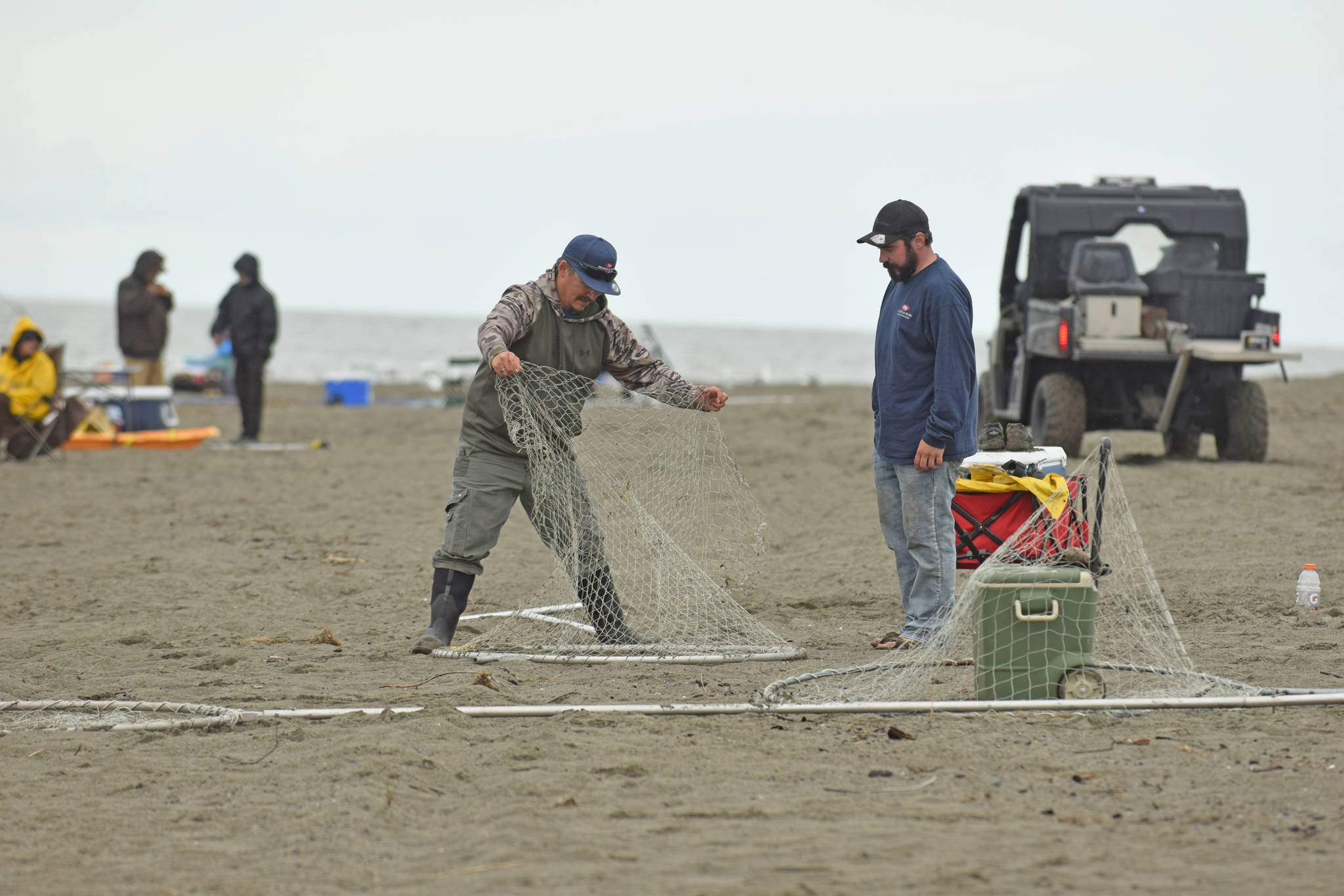 Fishermen ready their nets for dipnetting on Kenai Beach on Tuesday, July 10, 2018 in Kenai, Alaska. (Photo by Erin Thompson/Peninsula Clarion)
