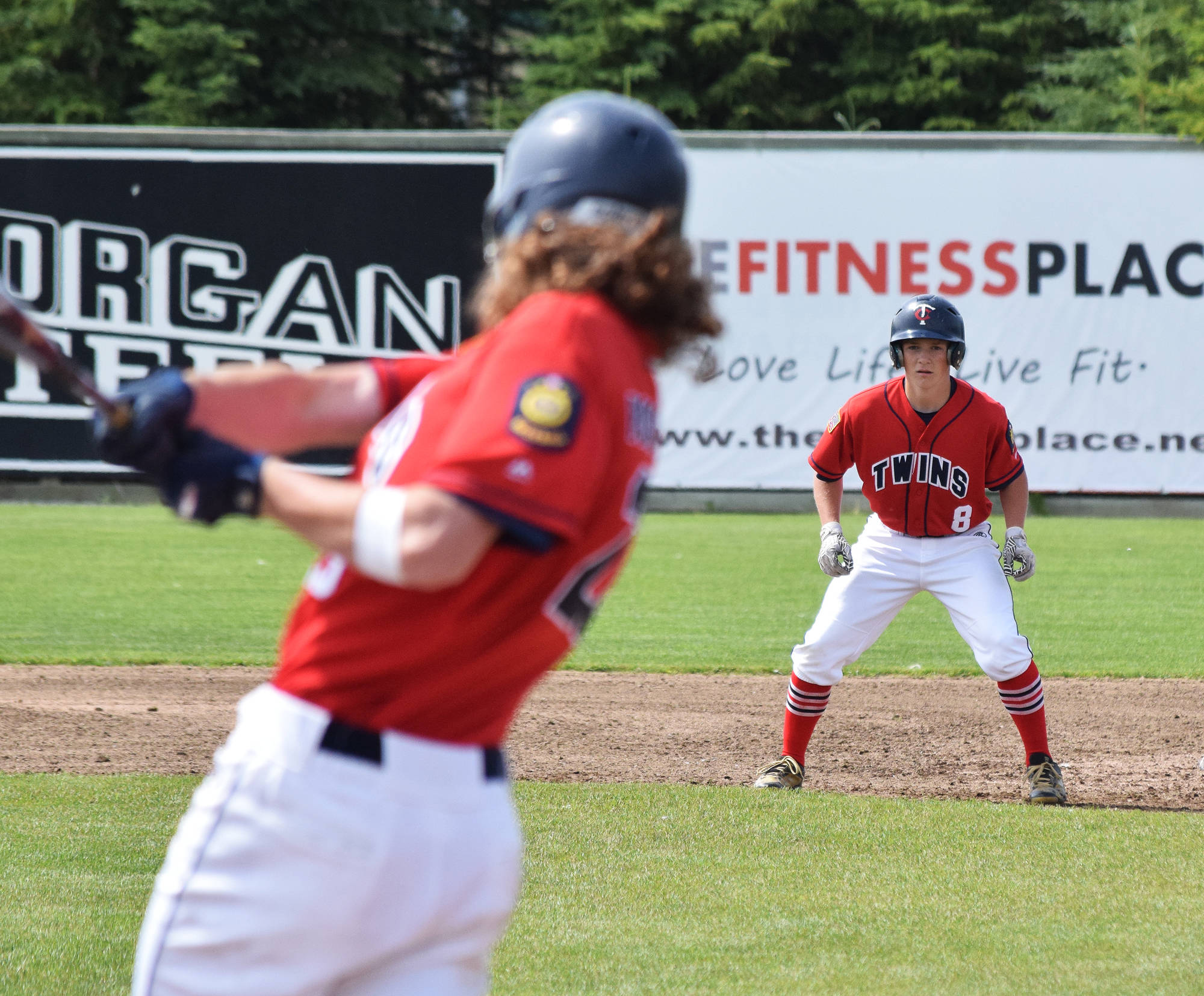 Legion Twins baserunner Harrison Metz (8) keeps an eye on batter David Michael Wednesday afternoon against South Anchorage at Coral Seymour Memorial Ballpark. (Photo by Joey Klecka/Peninsula Clarion)