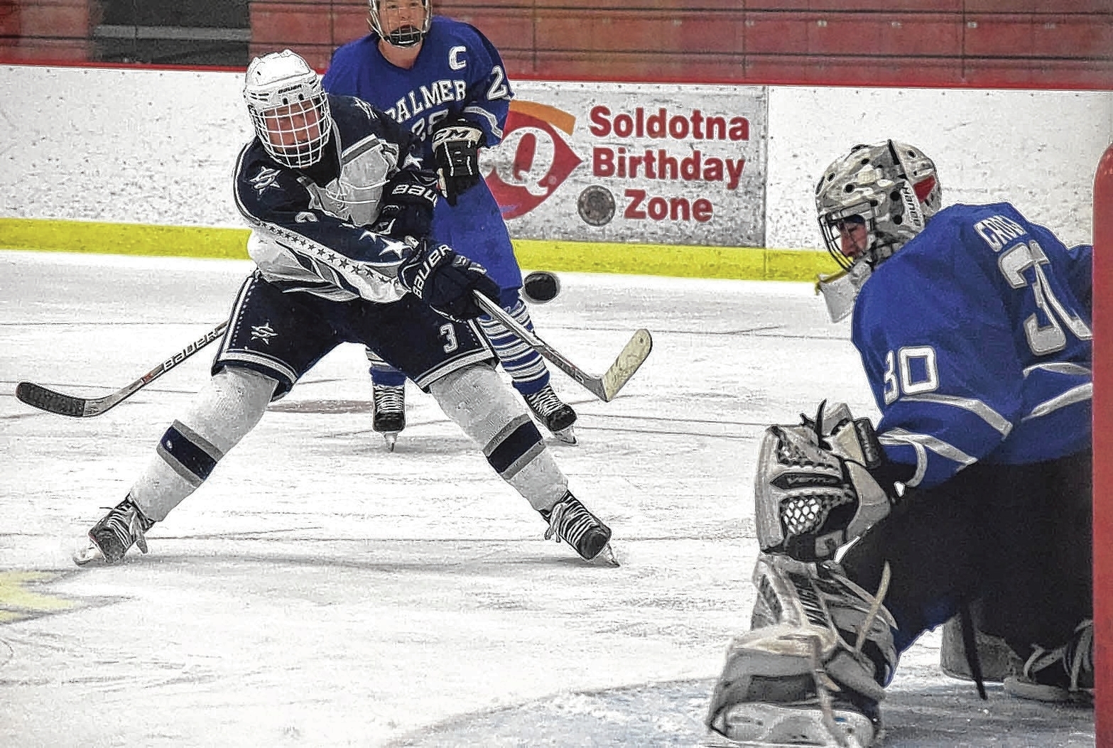 Soldotna forward Galen Brantley III fires a shot wide on Palmer goalie Cody Grogan on Friday at the Soldotna Regional Sports Complex. (Photo by Jeff Helminiak/Peninsula Clarion)