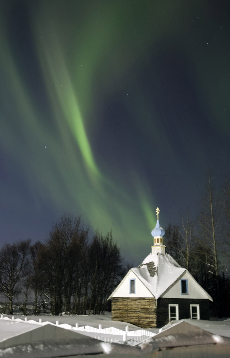 The northern lights illuminate the sky in Old Town Kenai.