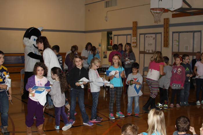 SMORE'S participants get books and t-shirts from Soldotna Rotarians.