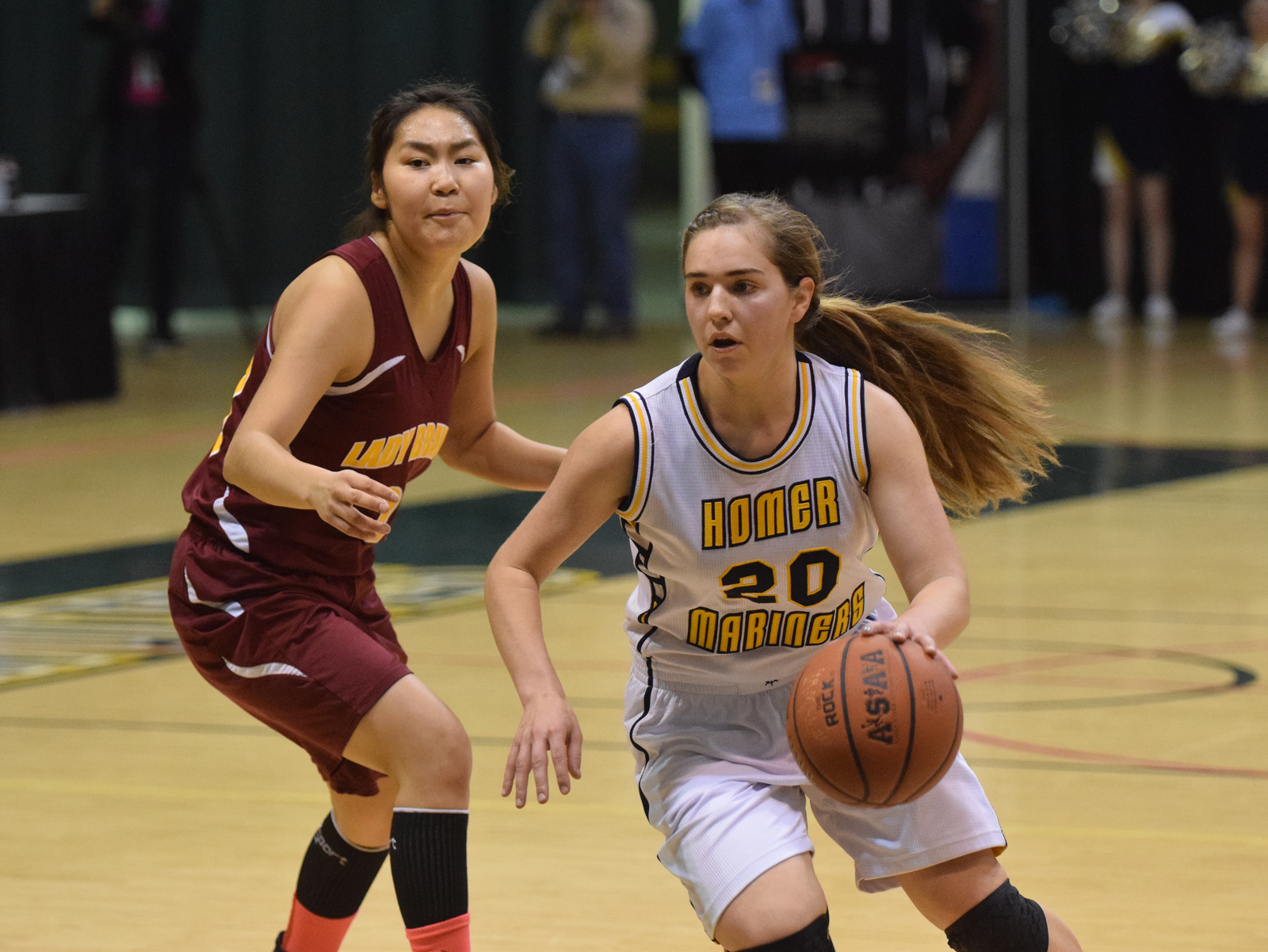 Homer senior Aurora Waclawski dribbles around Mt. Edgecumbe defender Julie Amaktoolik in Friday's Class 3A girls state semifinal at the Alaska Airlines