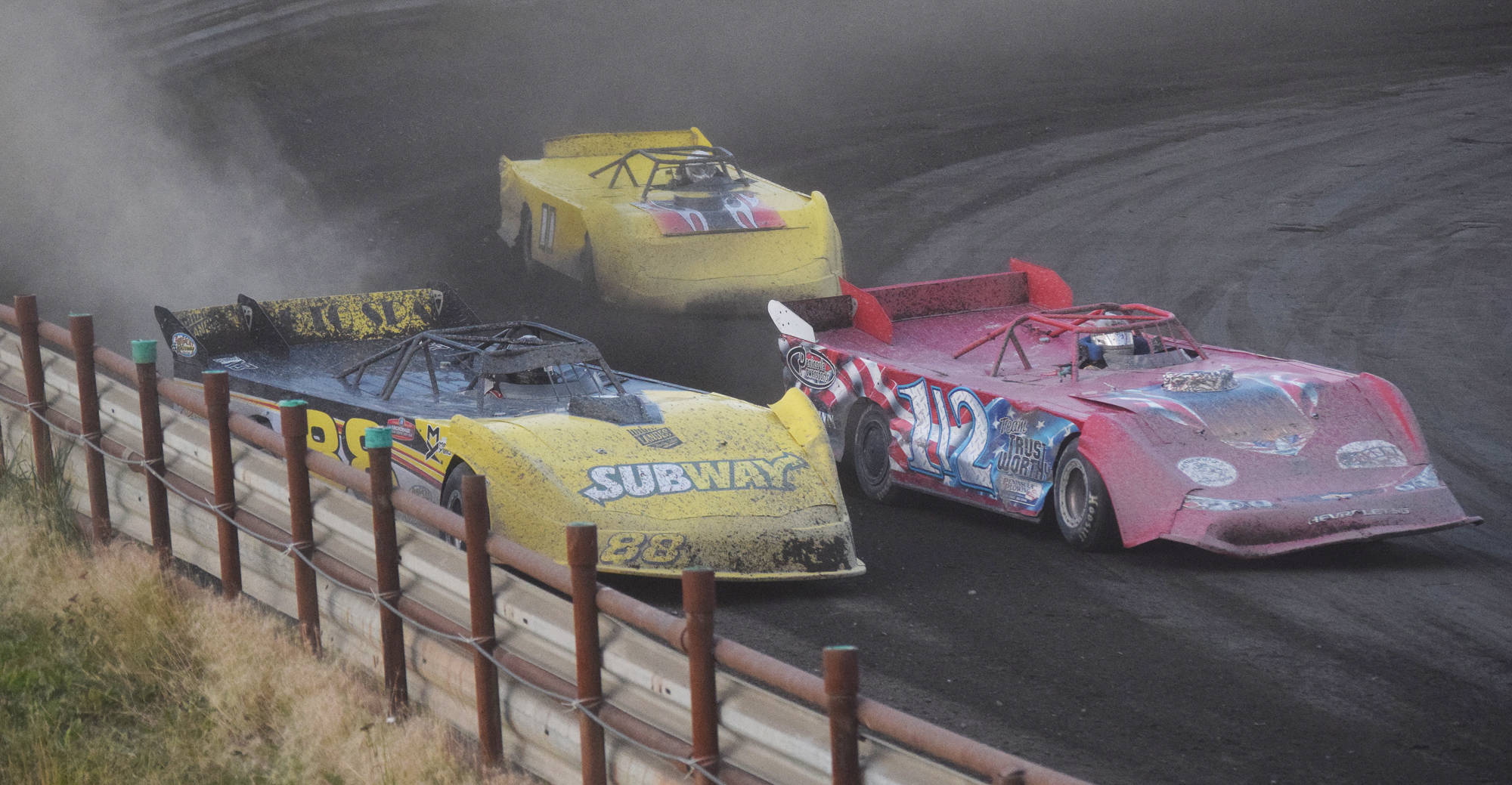 Justin Creech (left) and Sean Endsley (1/2) race closely off turn 2 in the Late Model feature race Friday night at Twin City Raceway in Kenai. (Photo by Joey Klecka/Peninsula Clarion)