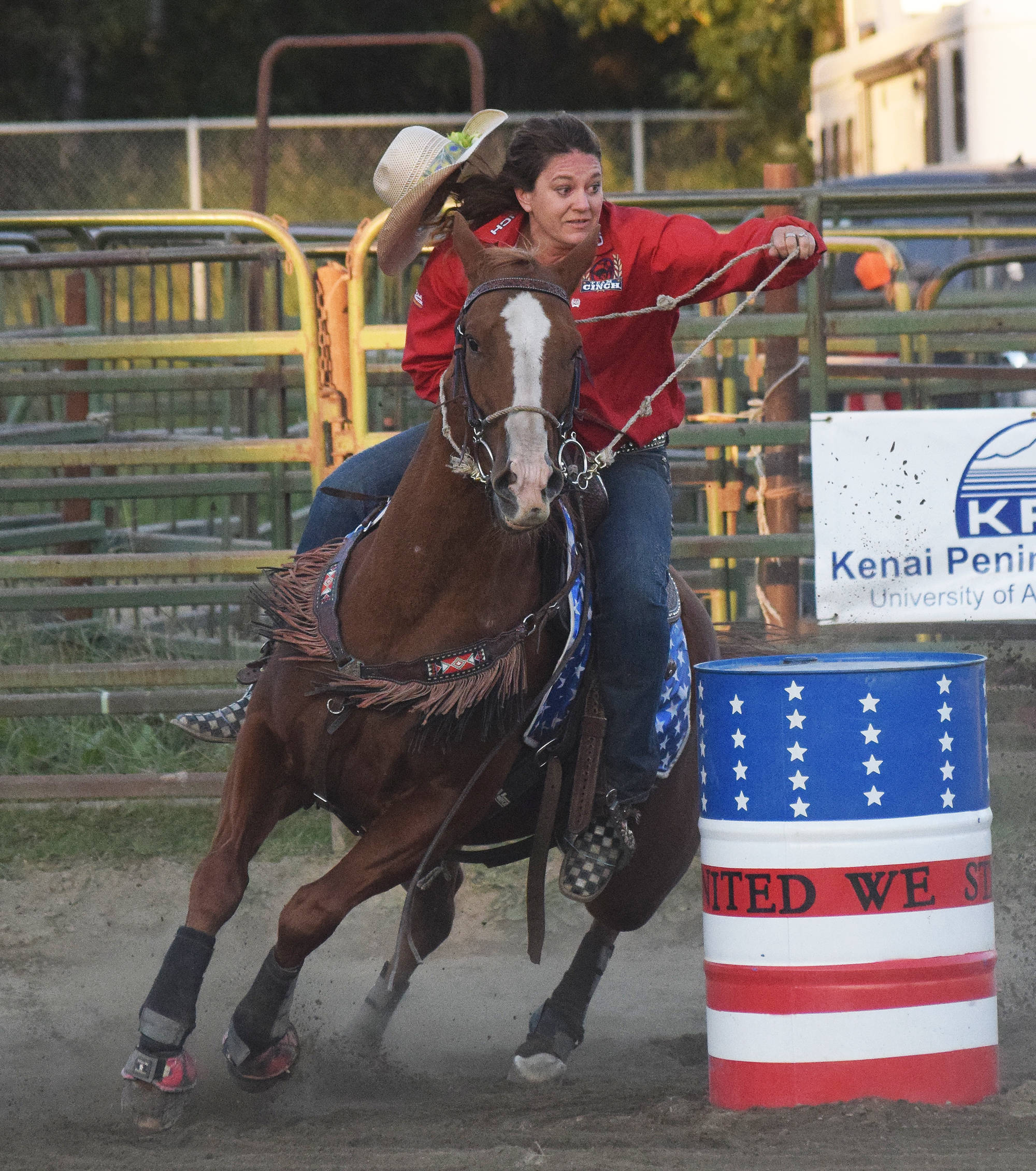A rider and her horse round a barrel Saturday, Sept. 8 at the 9/11 Tribute Rodeo at the Soldotna Rodeo Grounds in Soldotna, Alaska. (Photo by Joey Klecka/Peninsula Clarion)