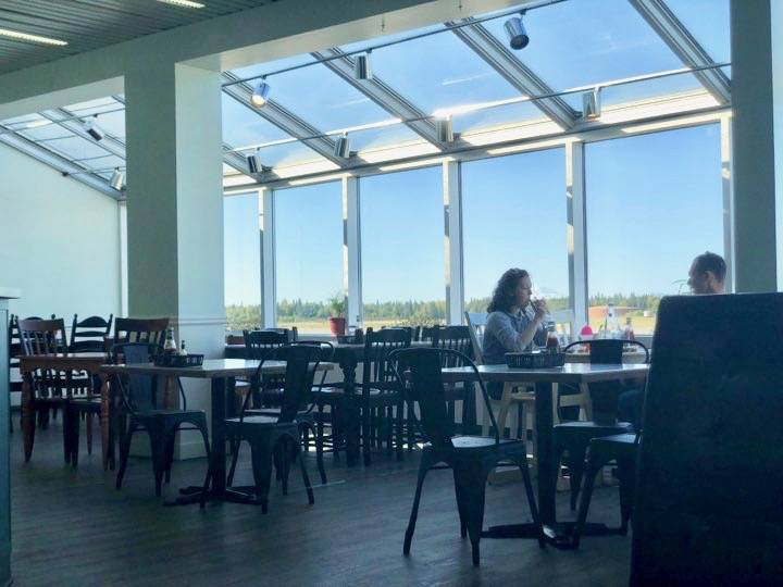 Patrons sit and eat lunch inside Kenai Airport’s newest restaurnt, Brother’s Cafe, on Monday, Sept. 18, 2018, in Kenai, Alaska. (Photo by Victoria Petersen/Peninsula Clarion)