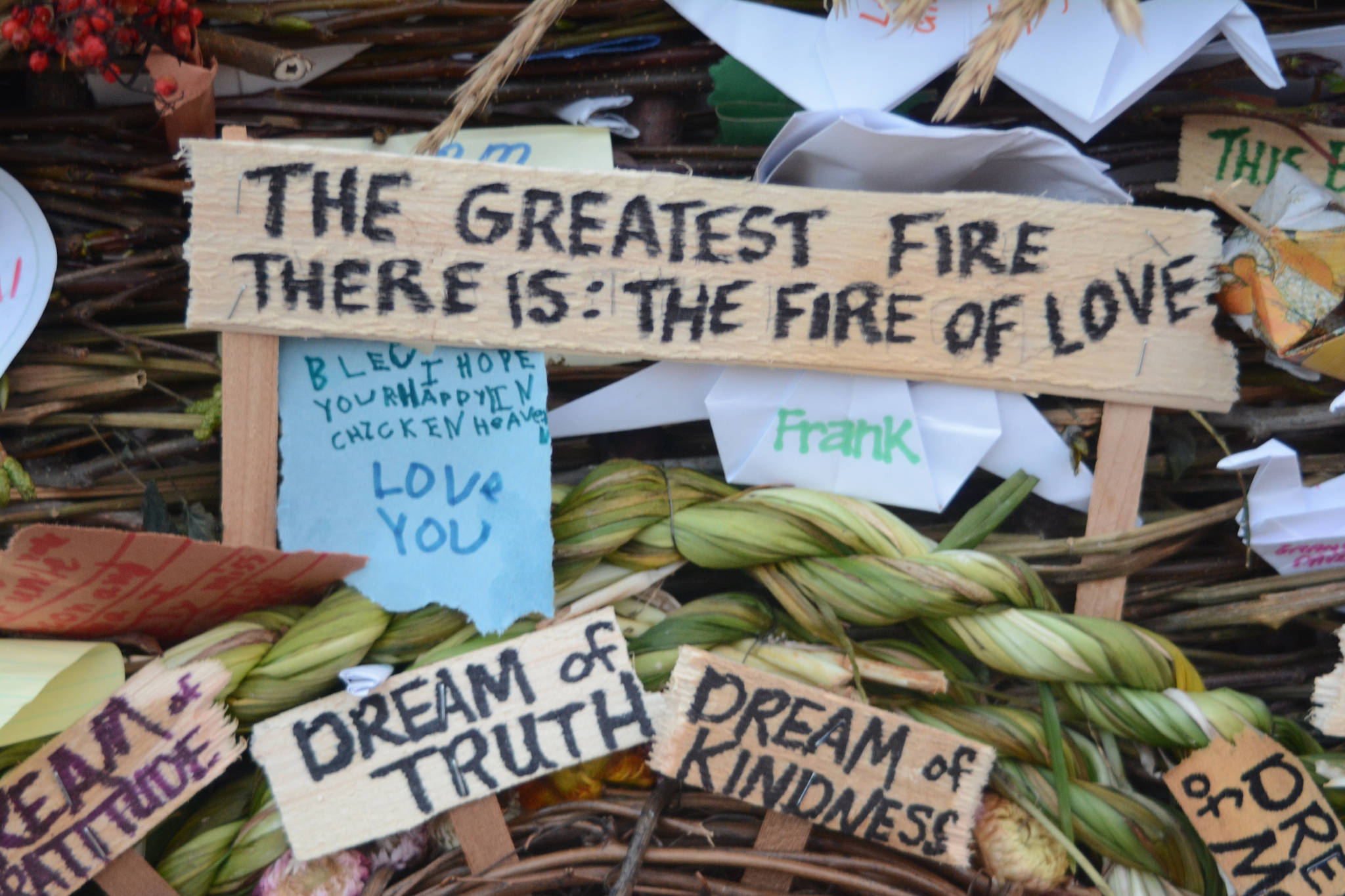 Signs and other objects adorn the 2018 Burning Basket, Dream, on Sept. 9, 2018 at Mariner Park in Homer, Alaska. (Photo by Michael Armstrong/Homer News)