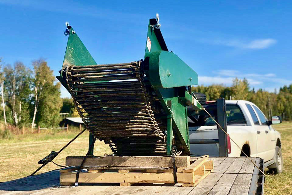 Kenai Soil and Water Conservation District’s newest farm equipment rental is a potato digger that will cut down on labor-intensive potato harvesting for area farmers. The equipment sits ready for use at Ridgeway Farms on Thursday, Sept. 13, 2018, near Soldotna, Alaska. (Photo by Victoria Petersen/Peninsula Clarion)