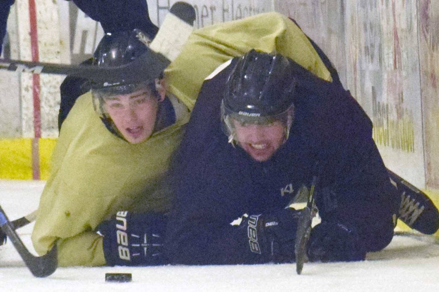 Preston Weeks of the Gold and Emils Ezitis of the Brown battle for the puck Friday, Sept. 7, 2018, in the Brown-Gold Game at the Kenai Multi-Purpose Facility. (Photo by Jeff Helminiak/Peninsula Clarion)