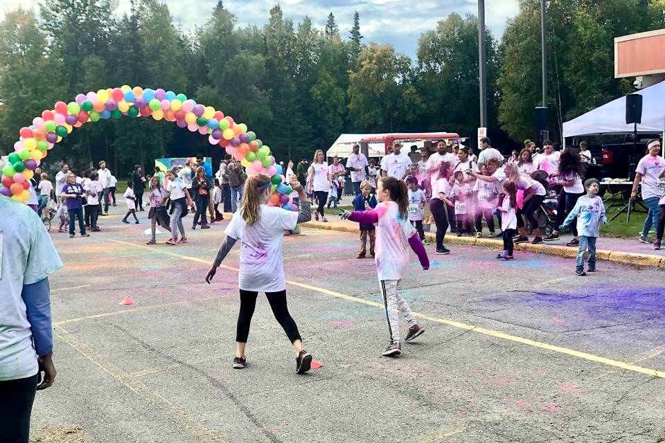 Students, staff, parents and community members gathered together for a color run and fundraise for a new greenhouse for Kaleidoscope school, on Saturday, Sept. 15, 2018, in Kenai, Alaska. (Photo by Victoria Petersen/Peninsula Clarion)