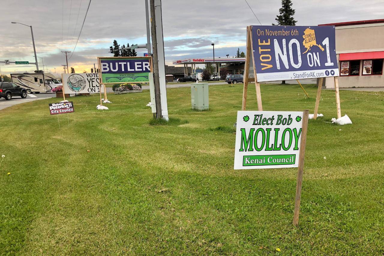 Election signs for Bob Molloy and Robert Peterkin, who are running for Kenai City Council in the Oct. 2 municipal election, stand among the many campaign signs lining the Kenai Spur Highway on Monday, Sept. 17, 2018, in Kenai, Alaska. (Photo by Victoria Petersen/Peninsula Clarion)