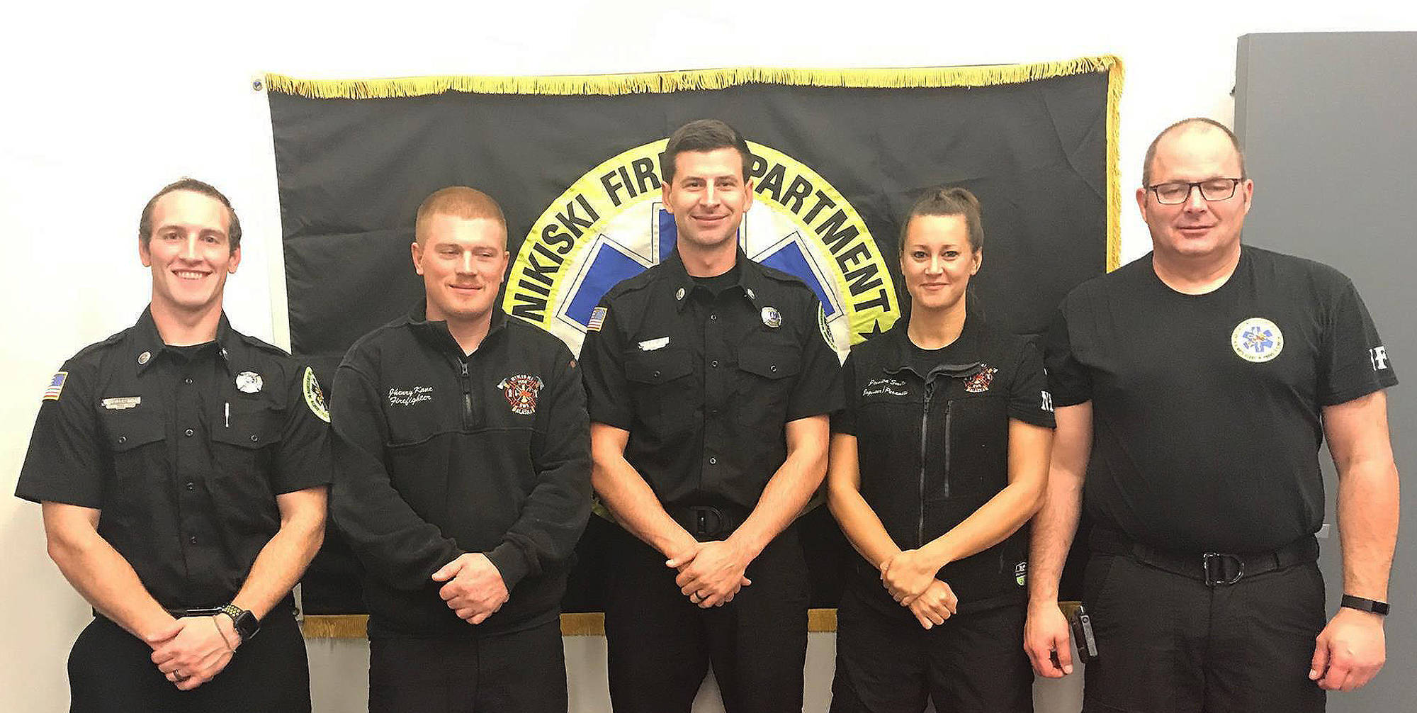 Levi Doss (middle) stands with his Nikiski Fire Department co-workers (from left to right) Ty Smith, Jhenry Kane, Jessica Smith and Barry Wheeler in 2017. (Photo provided by Levi Doss)