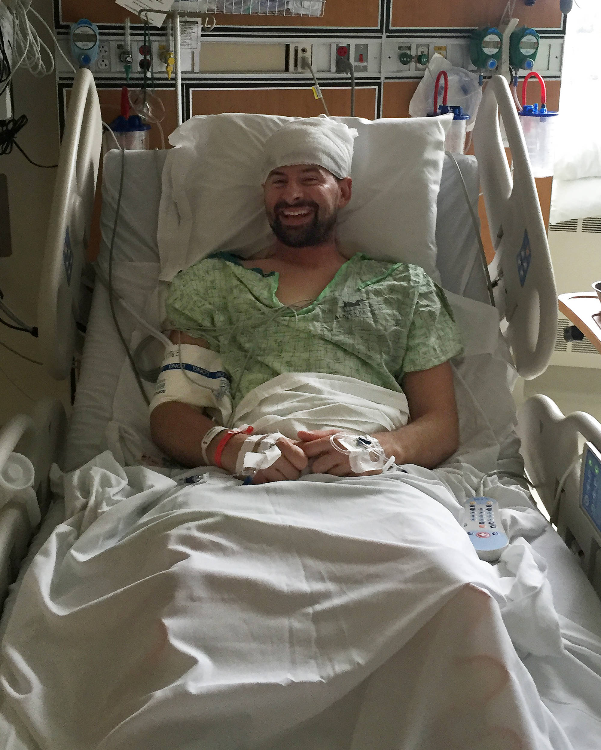 Nikiski firefighter Levi Doss reveals a smile while recovering from brain surgery in Anchorage in 2016. (Photo provided by Tera Doss)