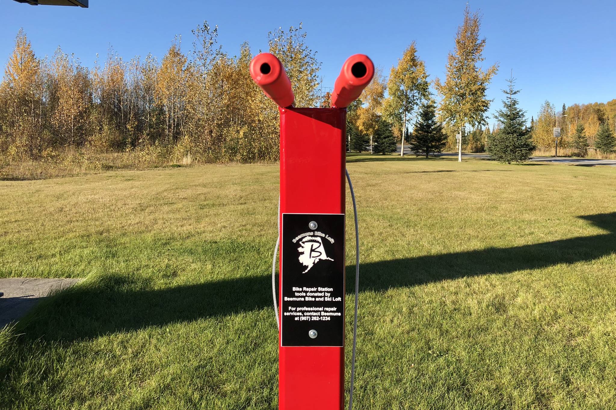 A new fix-it bike station set up on Monday by the Soldotna Parks and Recreation Department and bike advocacy group, BIK&S, AK, is photographed on Tuesday in Soldotna. The fix it station features a bike stand, tools and a tire pump. (Photo by Victoria Petersen/Peninsula Clarion)