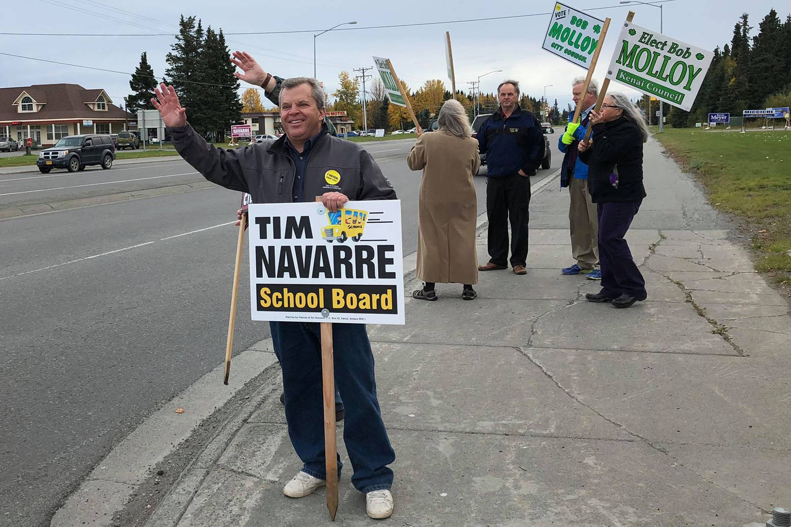 Kenai Peninsula Borough School Board member Tim Navarre campaigns for re-election along the Kenai Spur Highway on Tuesday, Oct. 2 in Kenai, Alaska.