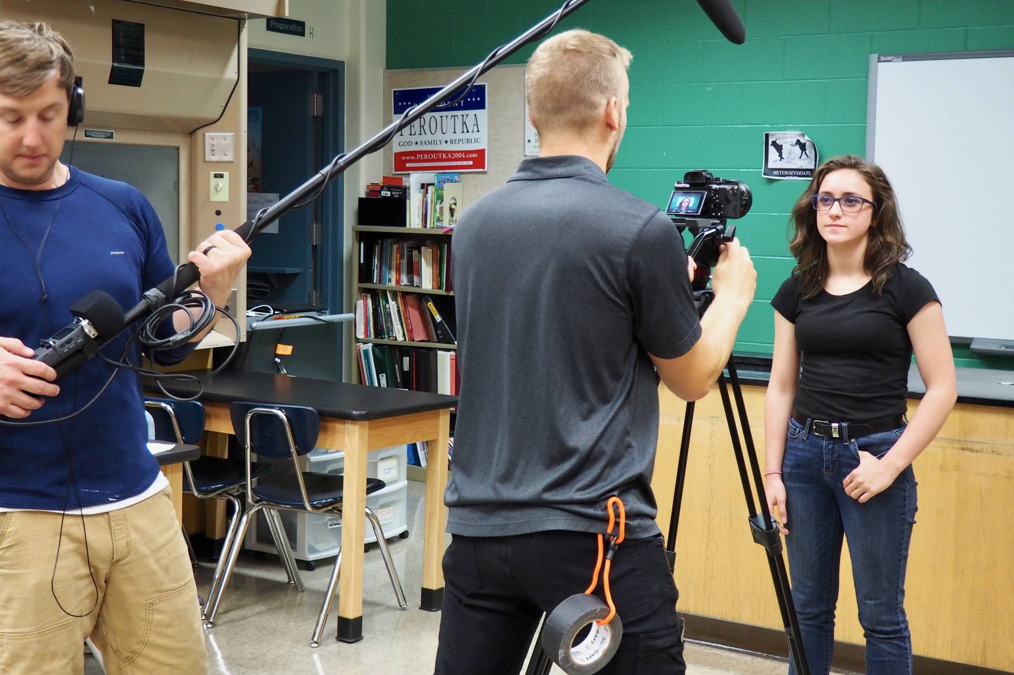 Silas Firth and Michael Miller help shoot a promo video about the Nikiski Children’s Fund with the founder, Carlee Rizzo, in this undated photo. (Photo courtesy of Joseph Rizzo).