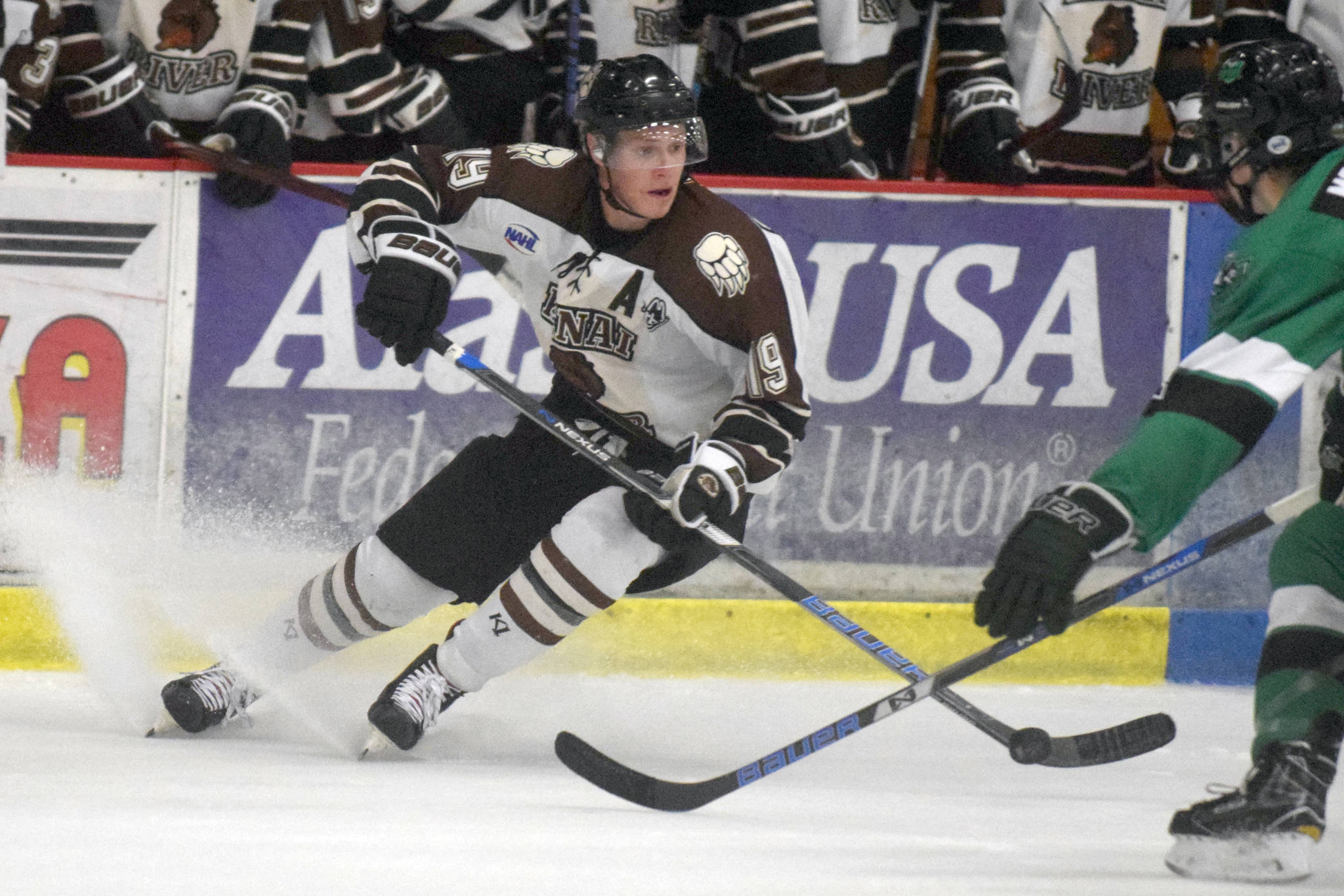 Kenai River Brown Bears forward Michael Spethmann looks to make a play as he enters the zone Friday, Oct. 5, 2018, against the Chippewa (Wisconsin) Steel at the Soldotna Regional Sports Complex. (Photo by Jeff Helminiak/Peninsula Clarion)