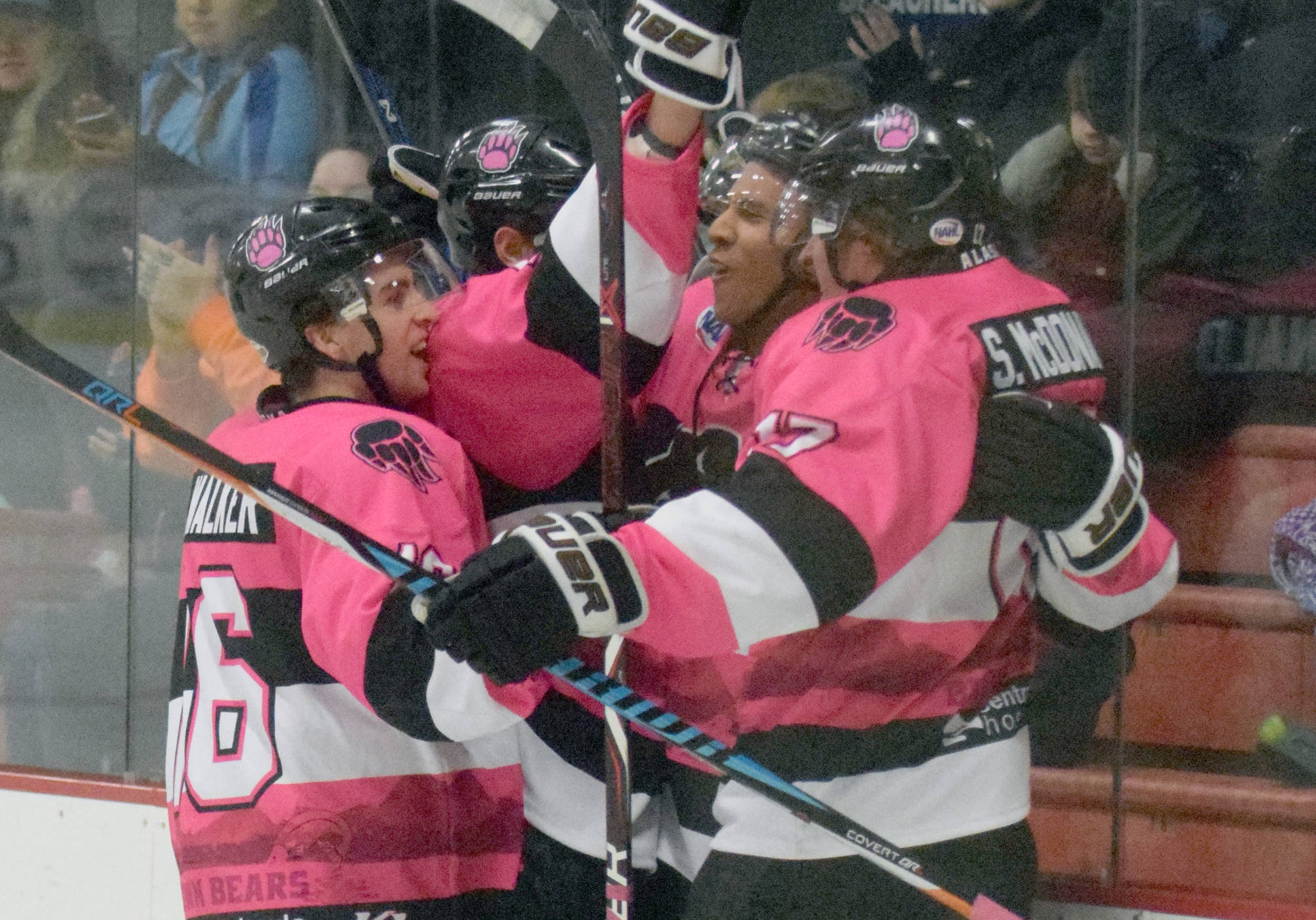 The Kenai River Brown Bears celebrate the first North American Hockey League goal of Ryan Reid (center) Friday, Oct. 12, 2018, at the Soldotna Regional Sports Complex. (Photo by Jeff Helminiak/Peninsula Clarion)