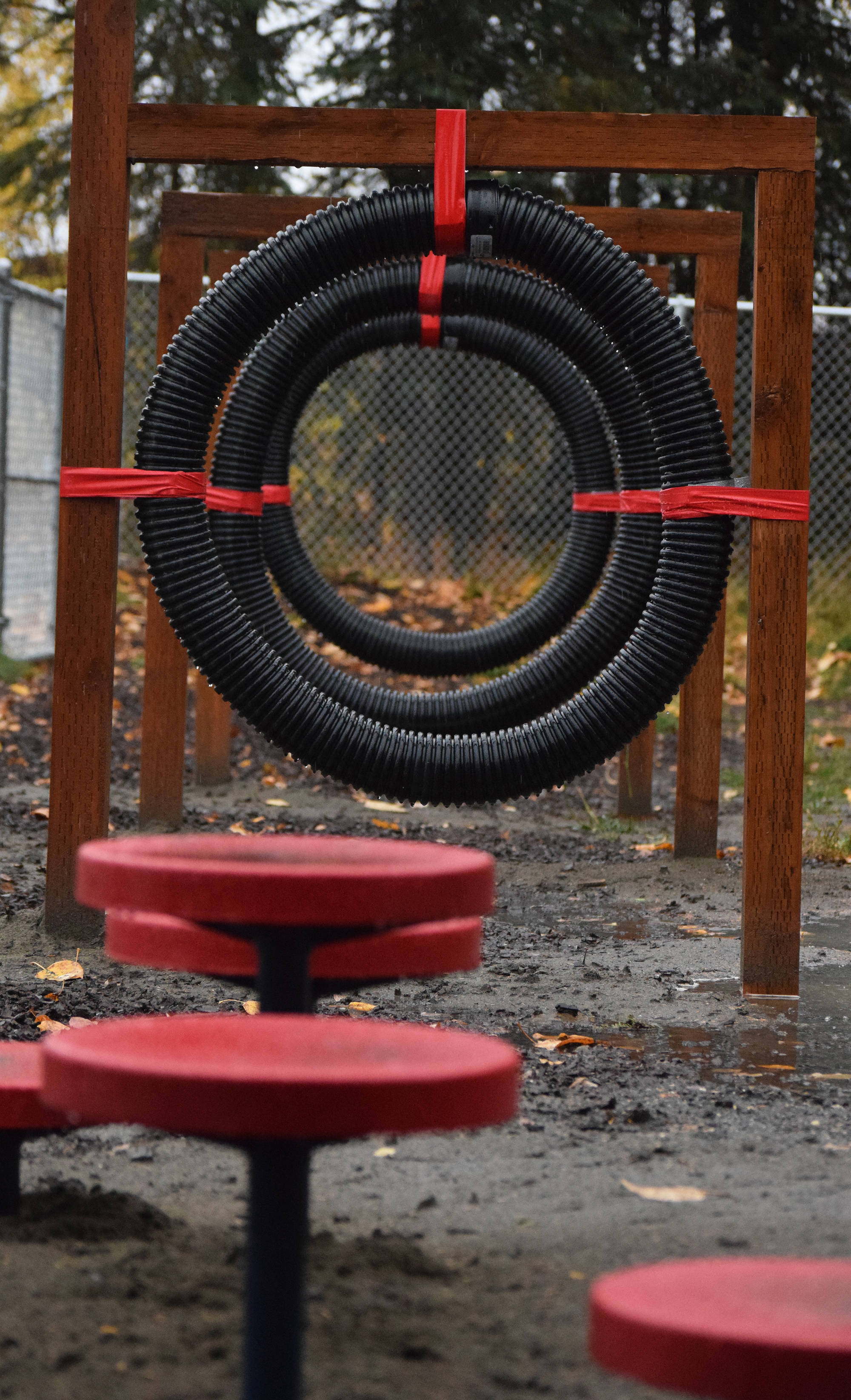 New additions to the 3 Friends Dog Park include a row of rings and uneven steps, seen here Friday afternoon in Soldotna. (Photo by Joey Klecka/Peninsula Clarion)