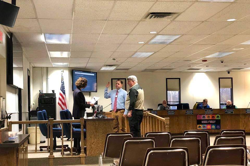 Mike Illg and Greg Madden are sworn into the Kenai Peninsula Borough School District Board of Education on Monday, Oct. 15, 2018, in Soldotna, AK. (Photo by Victoria Petersen/Peninsula Clarion)