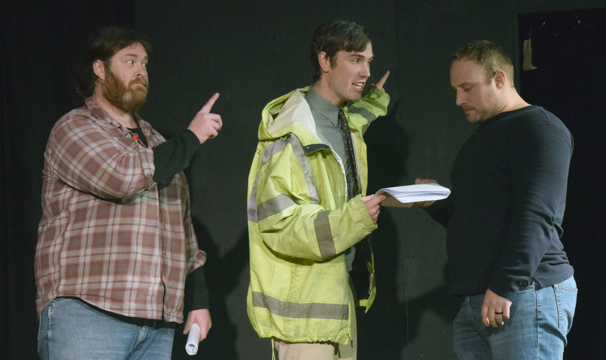 Shaylon Cochran, Brian Lyke and Tyler Payment rehearse a scene about political signage from “Lame Ducks and Dark Horses” on Monday at Triumvirate North five miles north of Kenai. (Photo by Jeff Helminiak/Peninsula Clarion)
