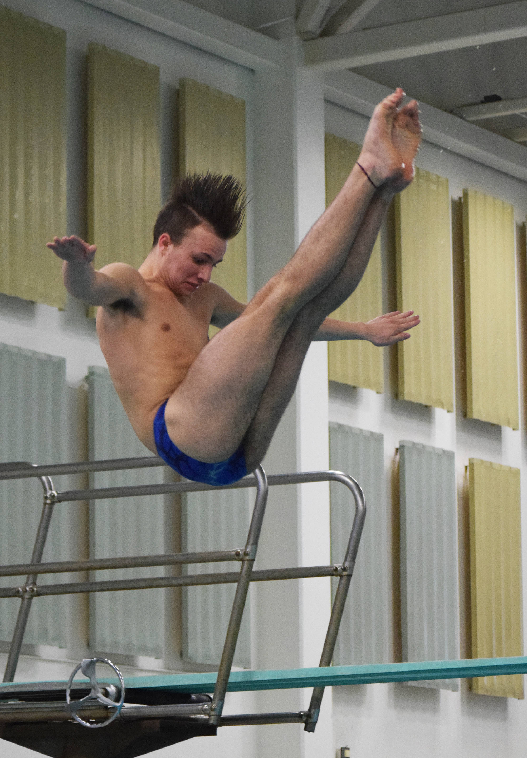 Soldotna senior Kylin Welch completes a dive Saturday in the boys 1-meter diving final at the 2018 ASAA swimming and diving state championships at Bartlett High School. (Photo by Joey Klecka/Peninsula Clarion)