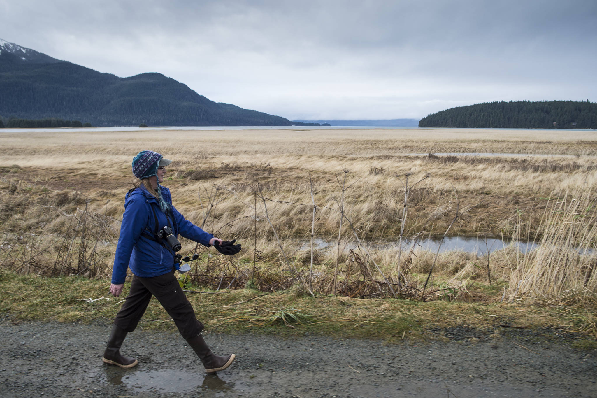 Laurie Lamm takes an exercise break on her lunch hour along the Airport Dike Trail on Thursday. (Michael Penn | Juneau Empire)
