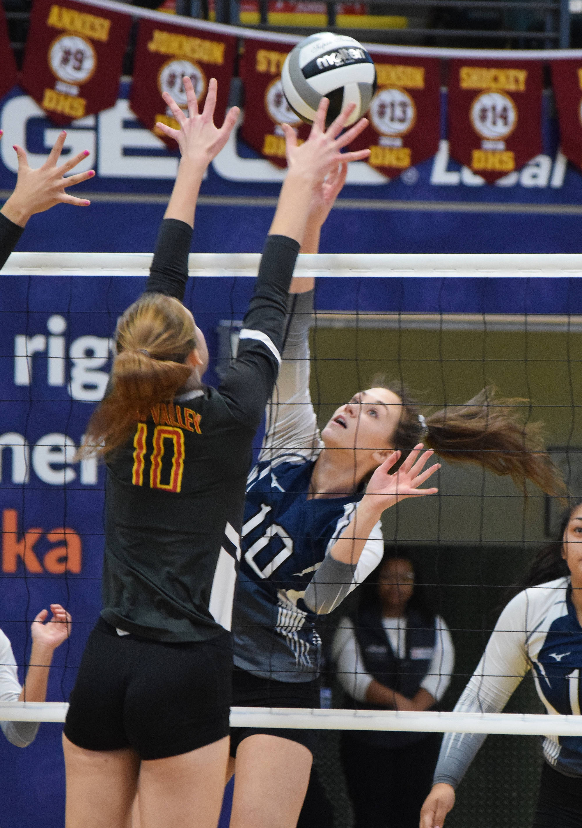 Soldotna’s Aliann Schmidt works against a block put up by West Valley’s Sonia McGaffigan (10) Thursday at the Class 4A state volleyball tournament at the Alaska Airlines Center. (Photo by Joey Klecka/Peninsula Clarion)
