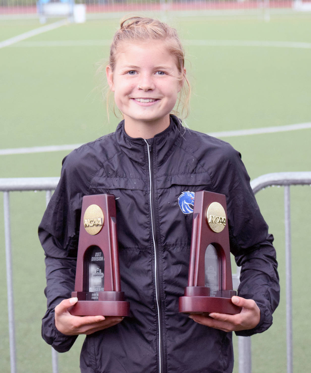 Boise State redshirt freshman Allie Ostrander shows off the first-place trophy from the 3,000-meter steeplechase and fourth-place trophy from the 5,000 meters, both earned at the NCAA Outdoor Track and Field Championship on Saturday, June 10, 2017, at Hayward Field in Eugene, Oregon. (Photo provided by Boise State Sports Information)