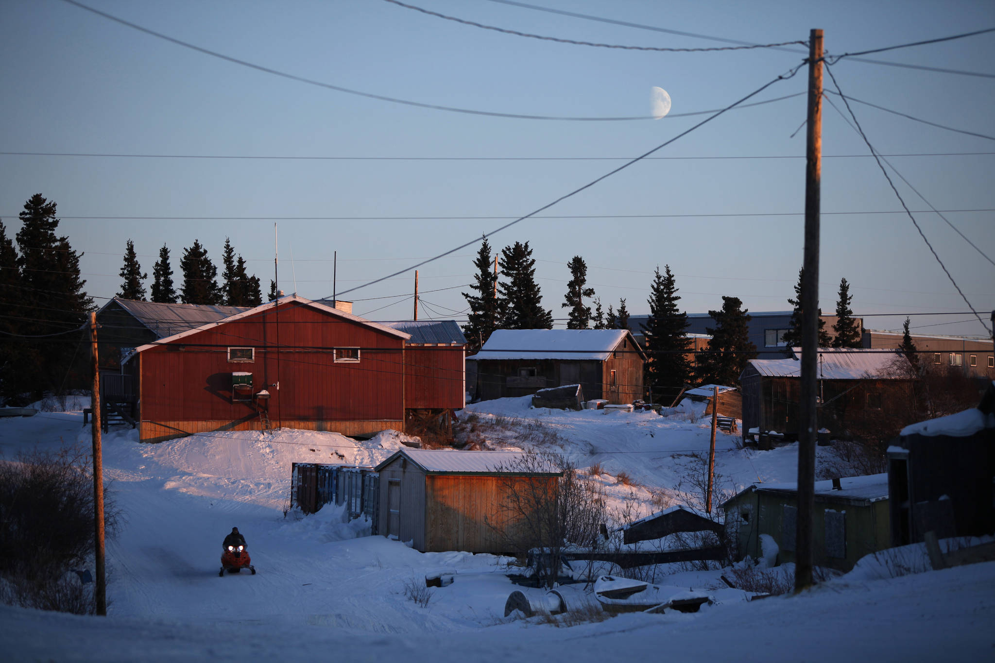 In this Jan. 24, 2010 file photo, the moon hangs low in the sky over the remote Inupiat Eskimo village Noorvik. Gov.-elect Mike Dunleavy will become Alaska’s top elected official Dec. 3, when he takes the oath of office in Noorvik. (AP Photo/Carolyn Kaster, File)