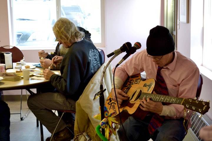 Live music is provided at the Kenai Peninsula Food Bank during an early Thanksgiving meal on Wednesday at its K-Beach Road facility near Soldotna. (Photo by Victoria Petersen/Peninsula Clarion)
