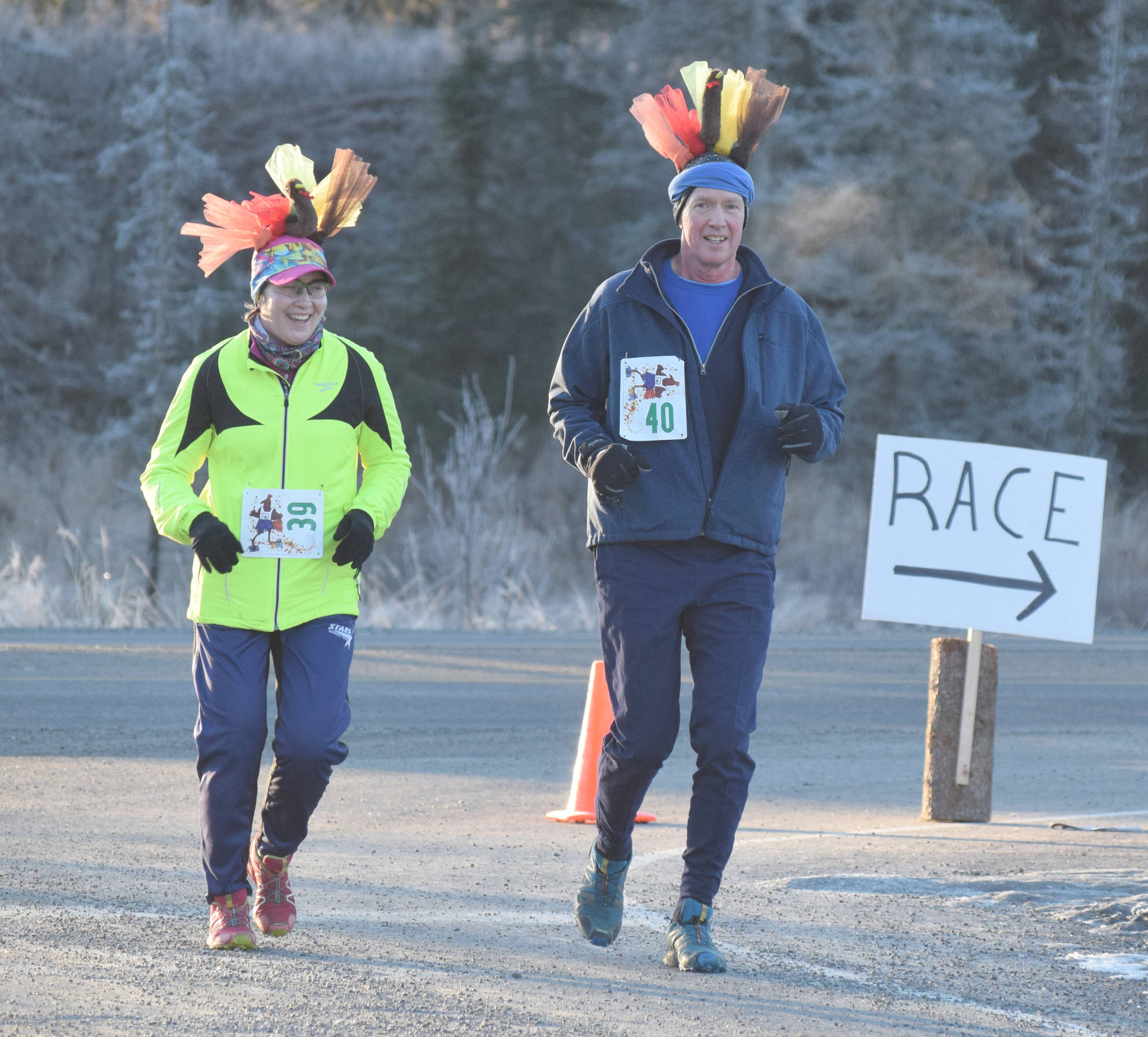 Sheilah-Margaret Pothast and John Pothast of Soldotna near the end of the three-mile run at the Turkey Trot at the Soldotna Regional Sports Complex on Thursday, Nov. 22, 2018. (Photo by Jeff Helminiak/Peninsula Clarion)