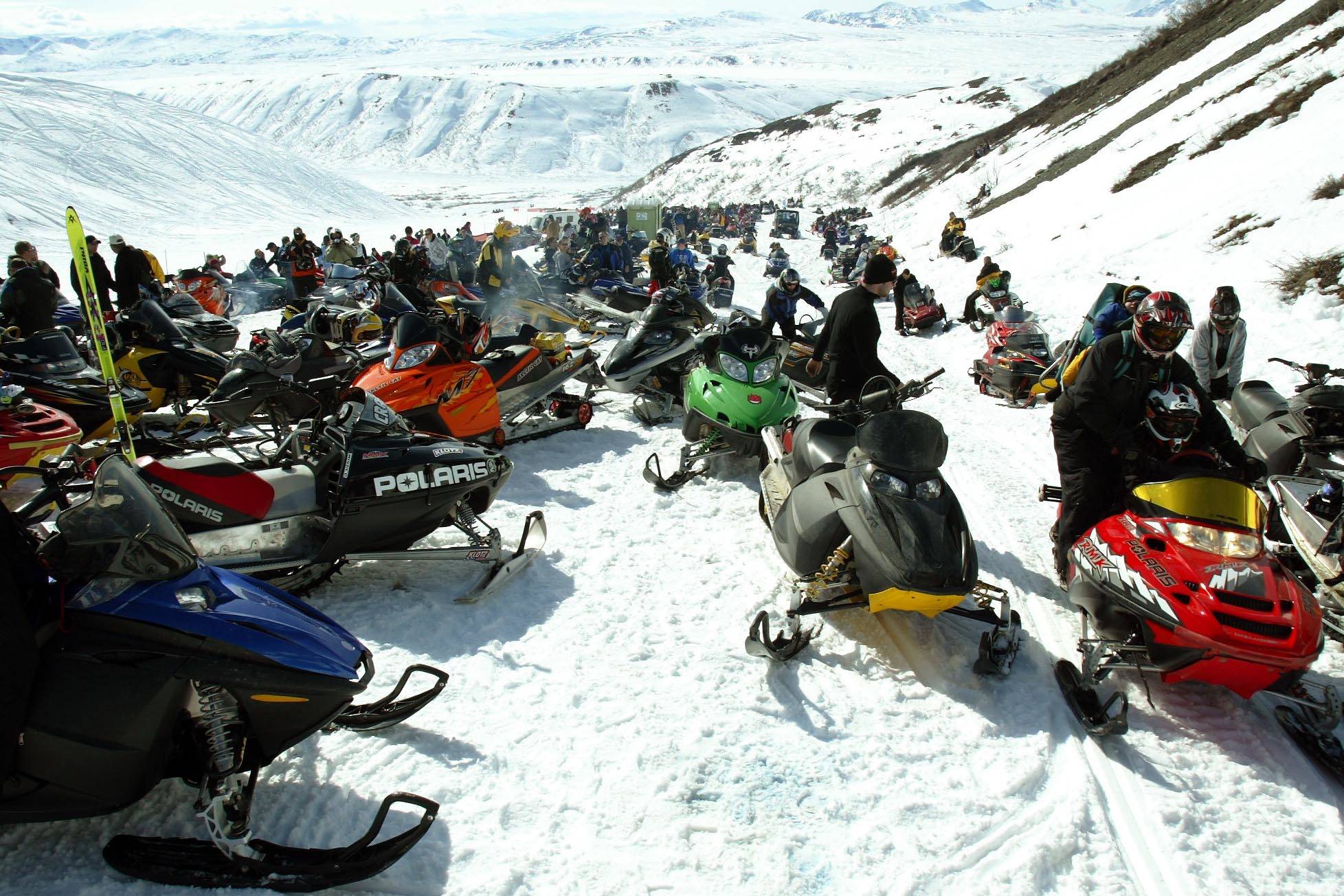 In this April 13, 2007, file photo, snowmachines gather around the finish chute during the 2007 Arctic Man Ski and Sno-Go Classic race in the HooDoo Mountains outside of Summit Lake, Alaska. (Eric Engman/Fairbanks Daily News-Miner via AP