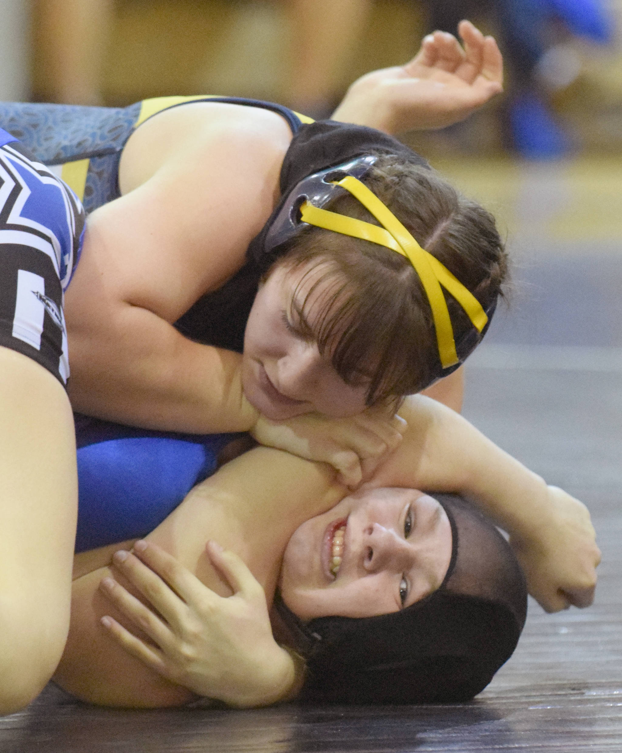 Homer’s McKenzie Cook controls Soldotna’s Amanda Wylie at 152 pounds Tuesday, Nov. 27, 2018, at Soldotna Prep. Cook would pin Wylie. (Photo by Jeff Helminiak/Peninsula Clarion)